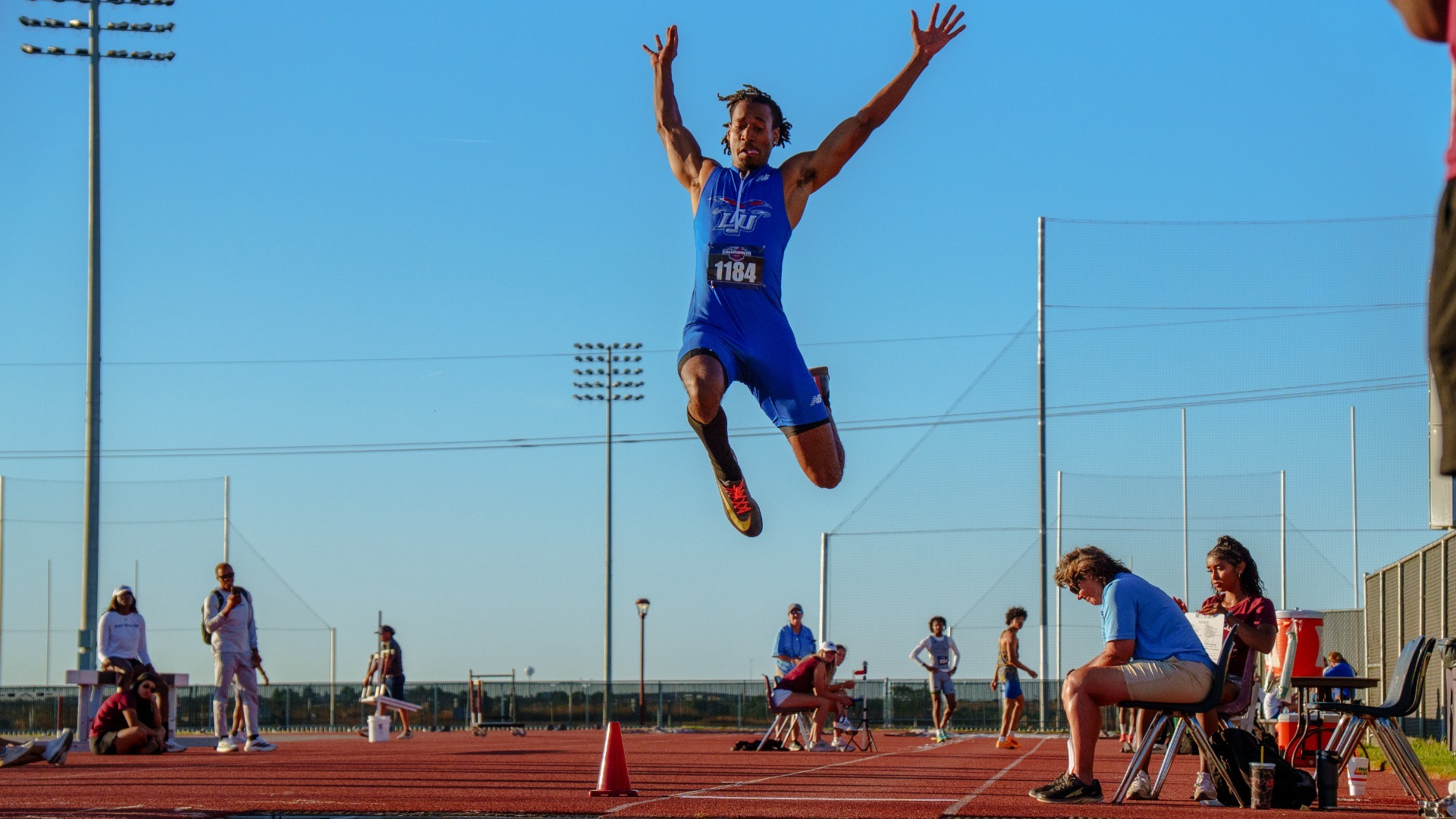 This is a photo of Lubbock Christian track athlete Maurice Gray participating in the long jump at the Lone Star Conference Track and Field Outdoor Championships.