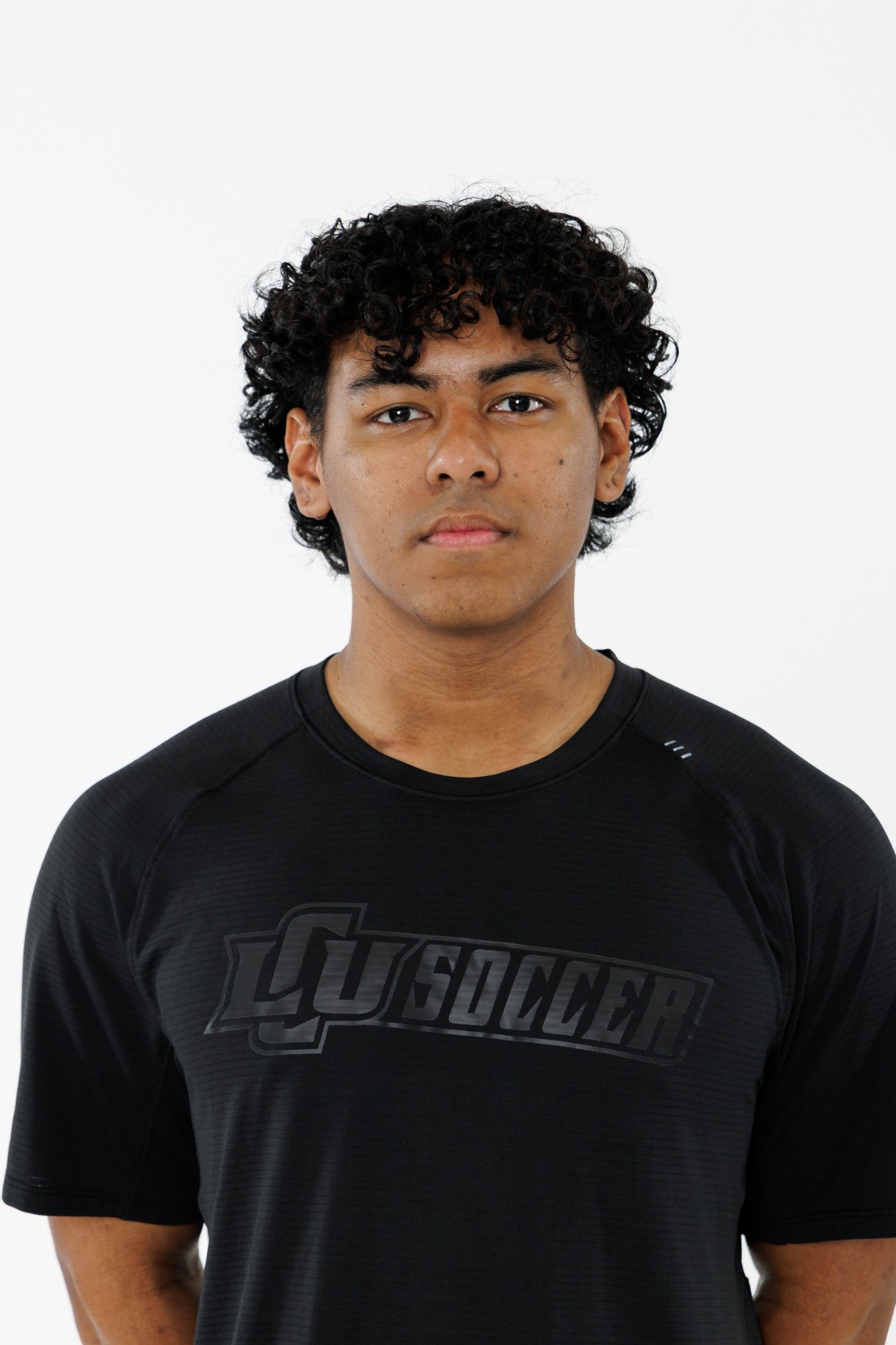 Head shot of an LCU men's soccer player in a black polo