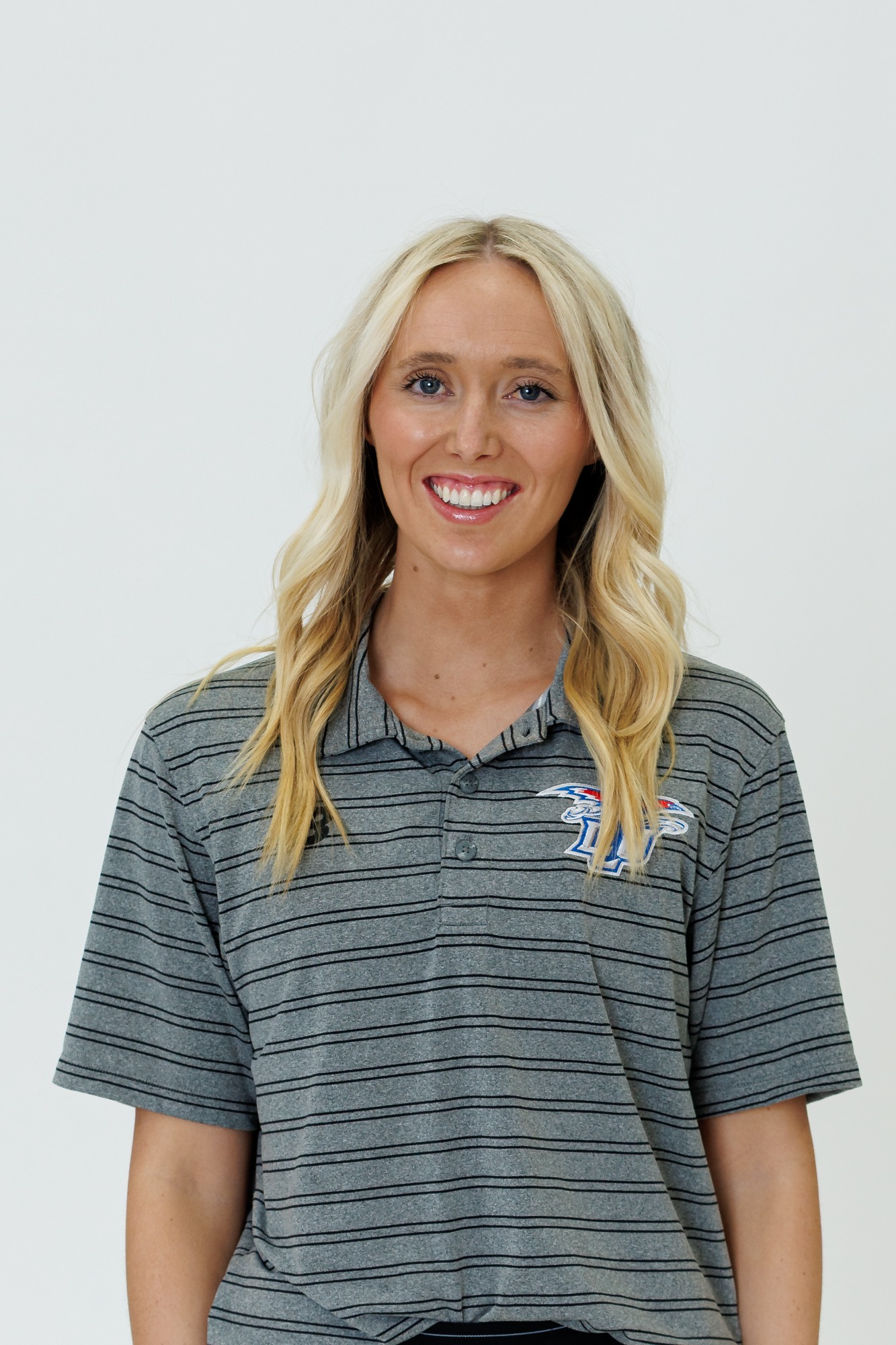 Headshot of Kinley Cornelsen wearing a grey polo. 