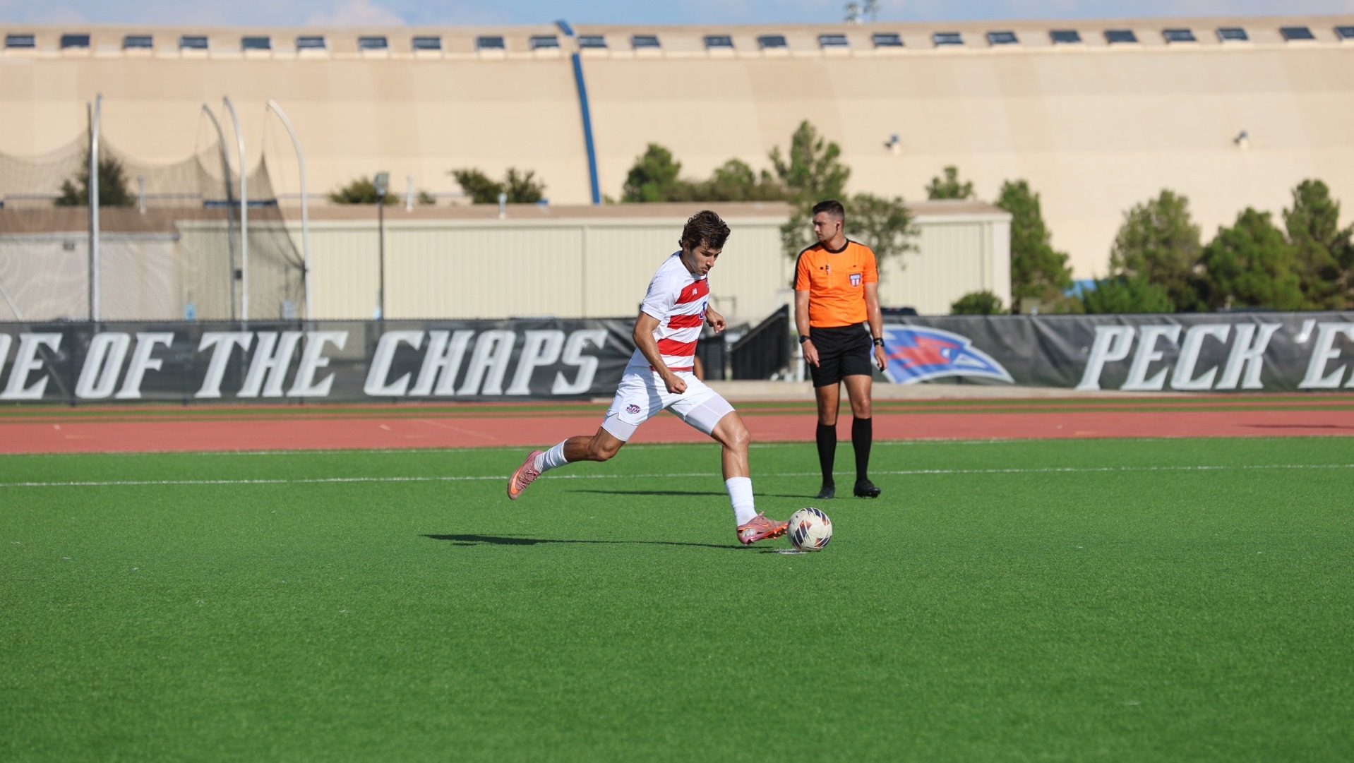 This is a photo of Lubbock Christian midfielder Joao Catafesta preparing to kick the ball for a penalty kick during a game at the LCU Soccer & Track Complex. 