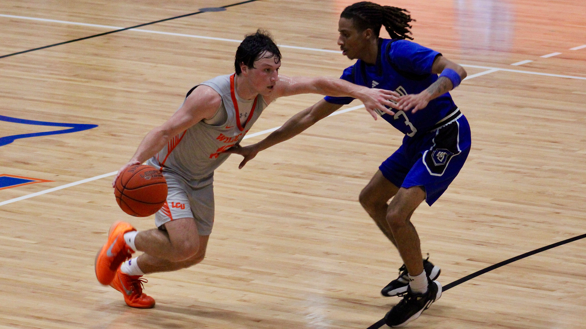 Drew Tebbe drives on a Dillard defender 11/18/25