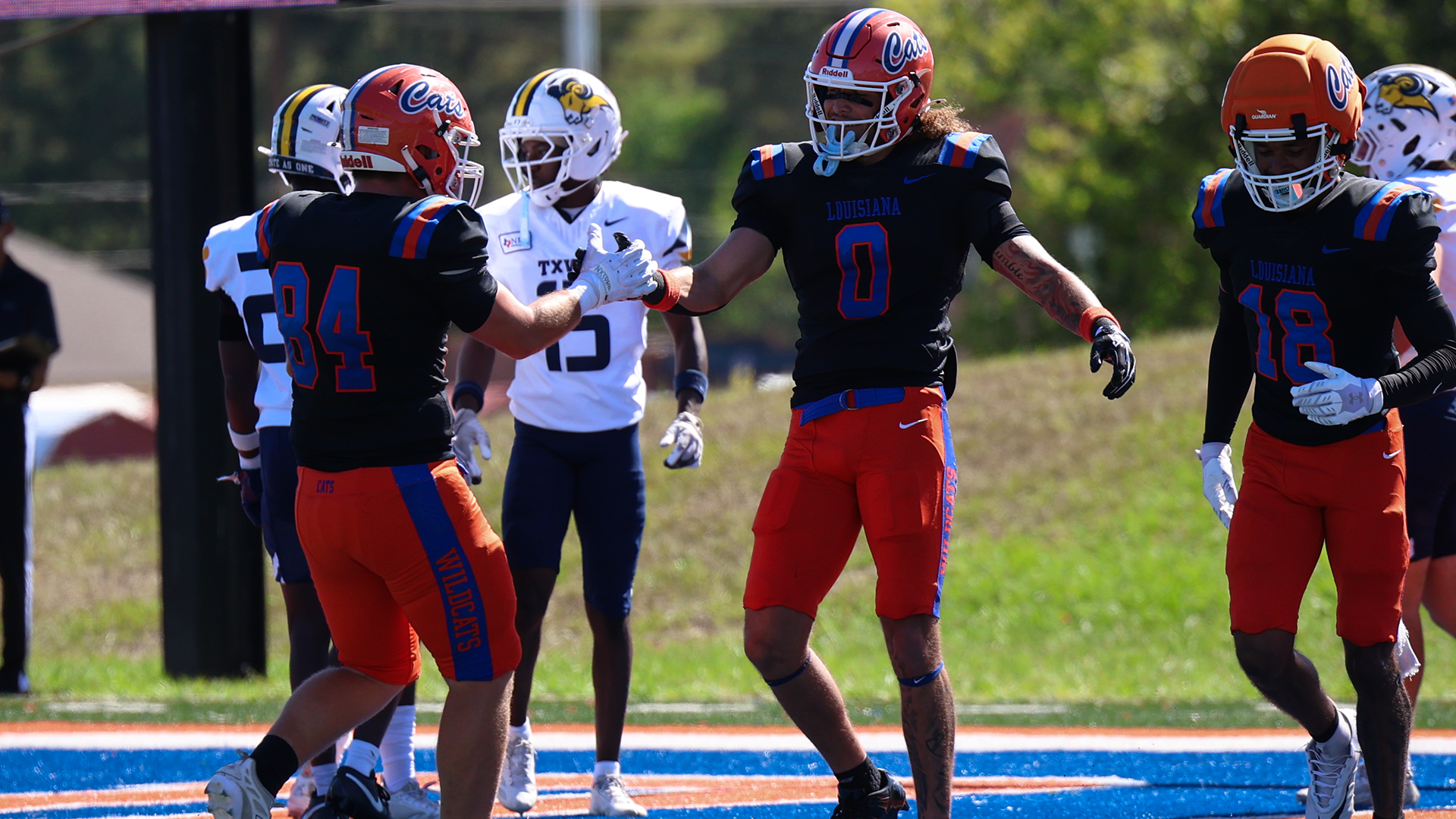 Omarius Davis celebrates with Grayson Thibodeaux following touchdown vs. Texas Wesleyan 10/10/26