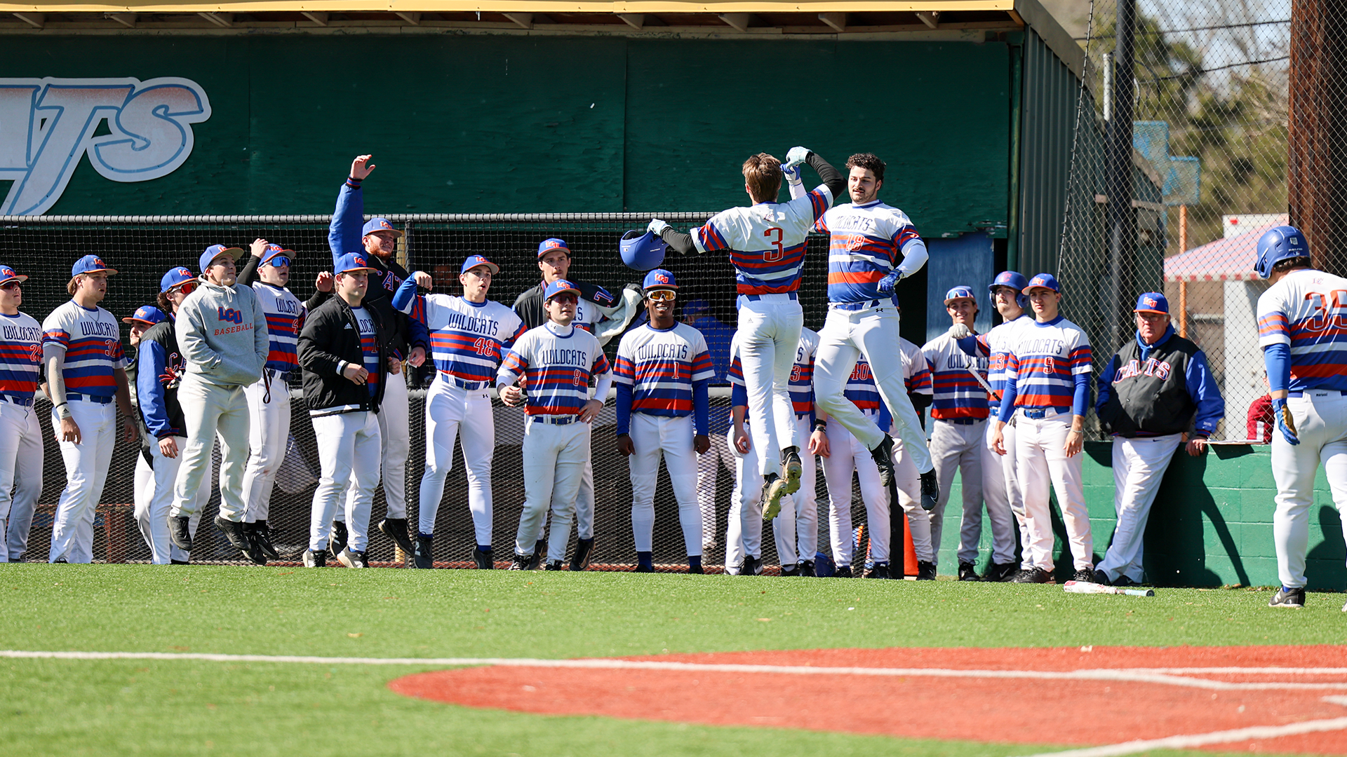 Braden McLin & Harrison Waxley jump in celebration in front of teammates after McLin home run vs. CIU 2/5/26