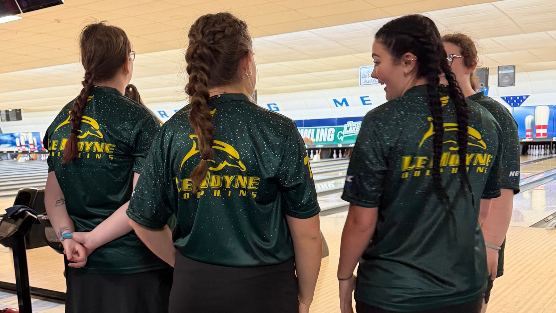 Members of the women's bowling team huddle at Mercyhurst Invitational