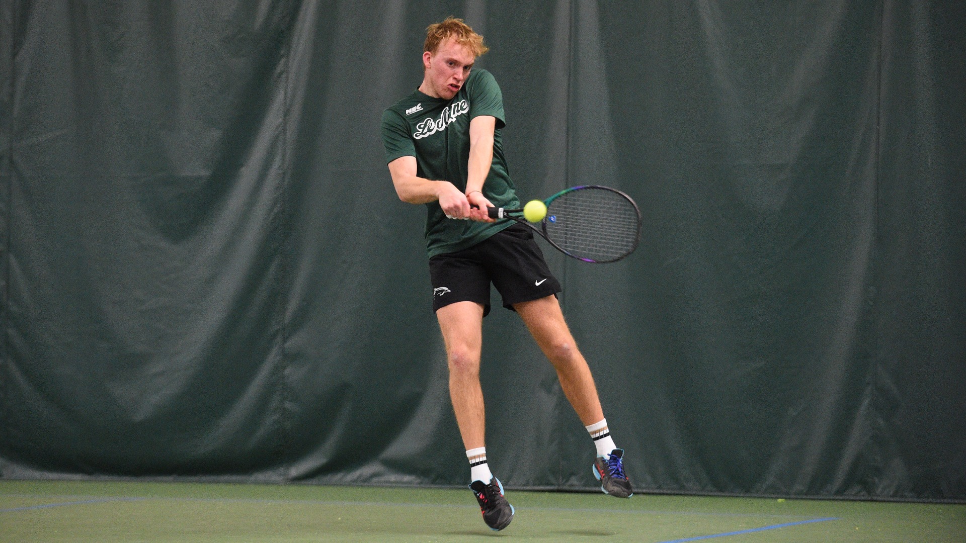 Luke Hoyland hits a backhand against Stonehill