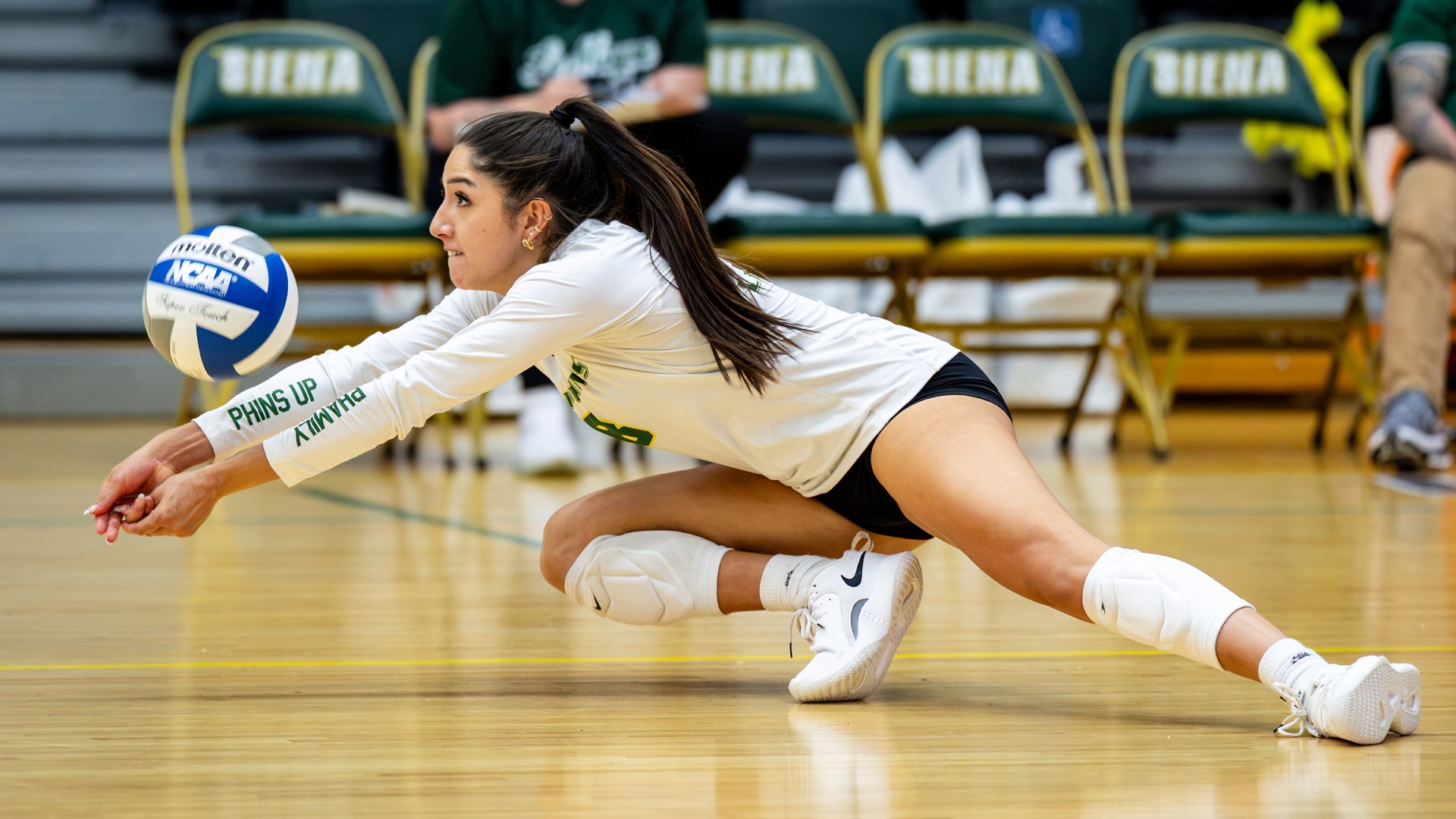 Nina Salas digs the ball during a match at the Siena Invitational