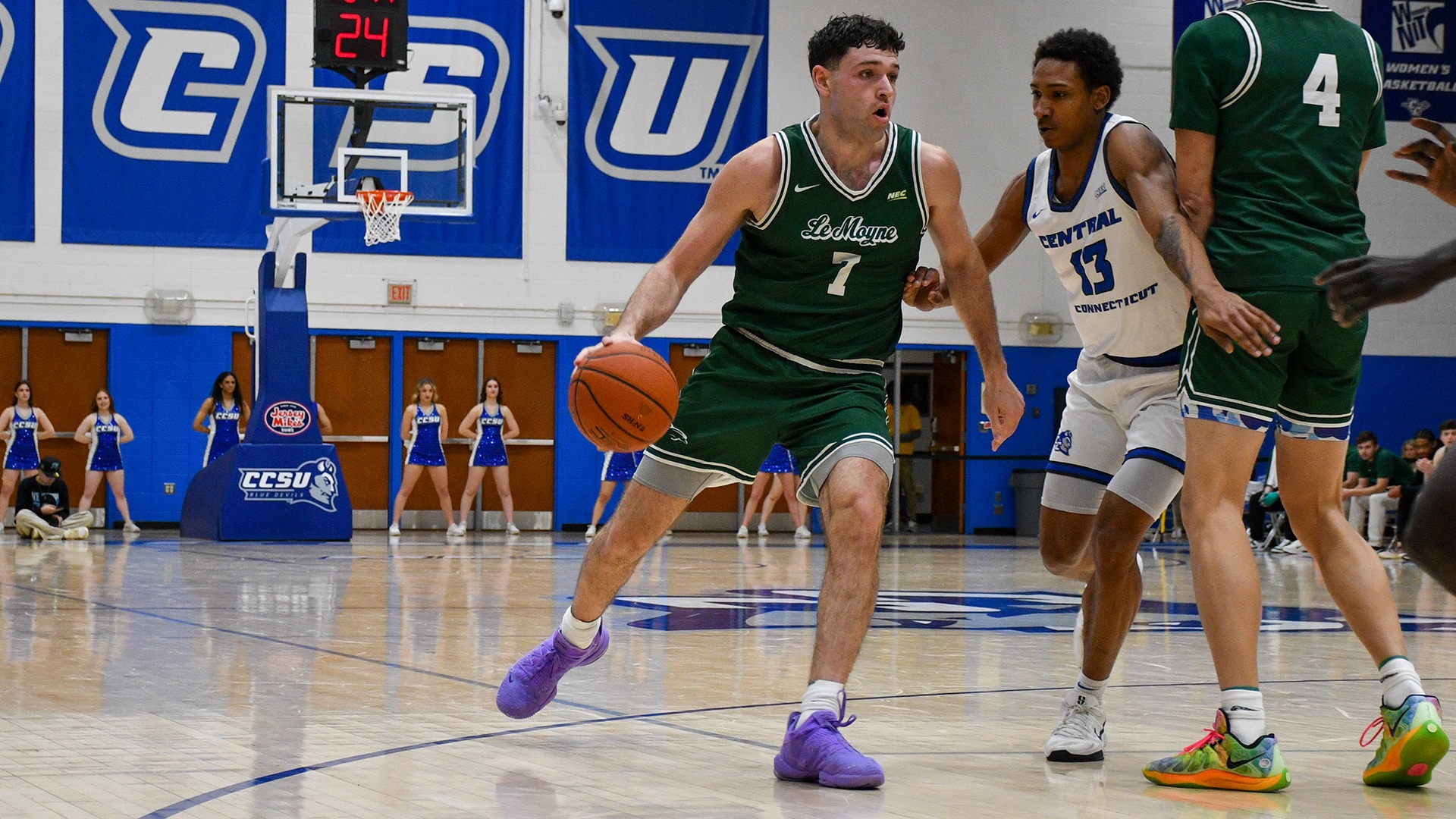 Mosquera dribbles around a screen against Central Connecticut State 