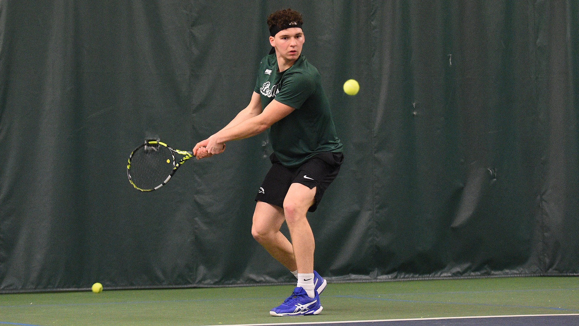 Carlo Zucchini attempts a backhand against Stonehill
