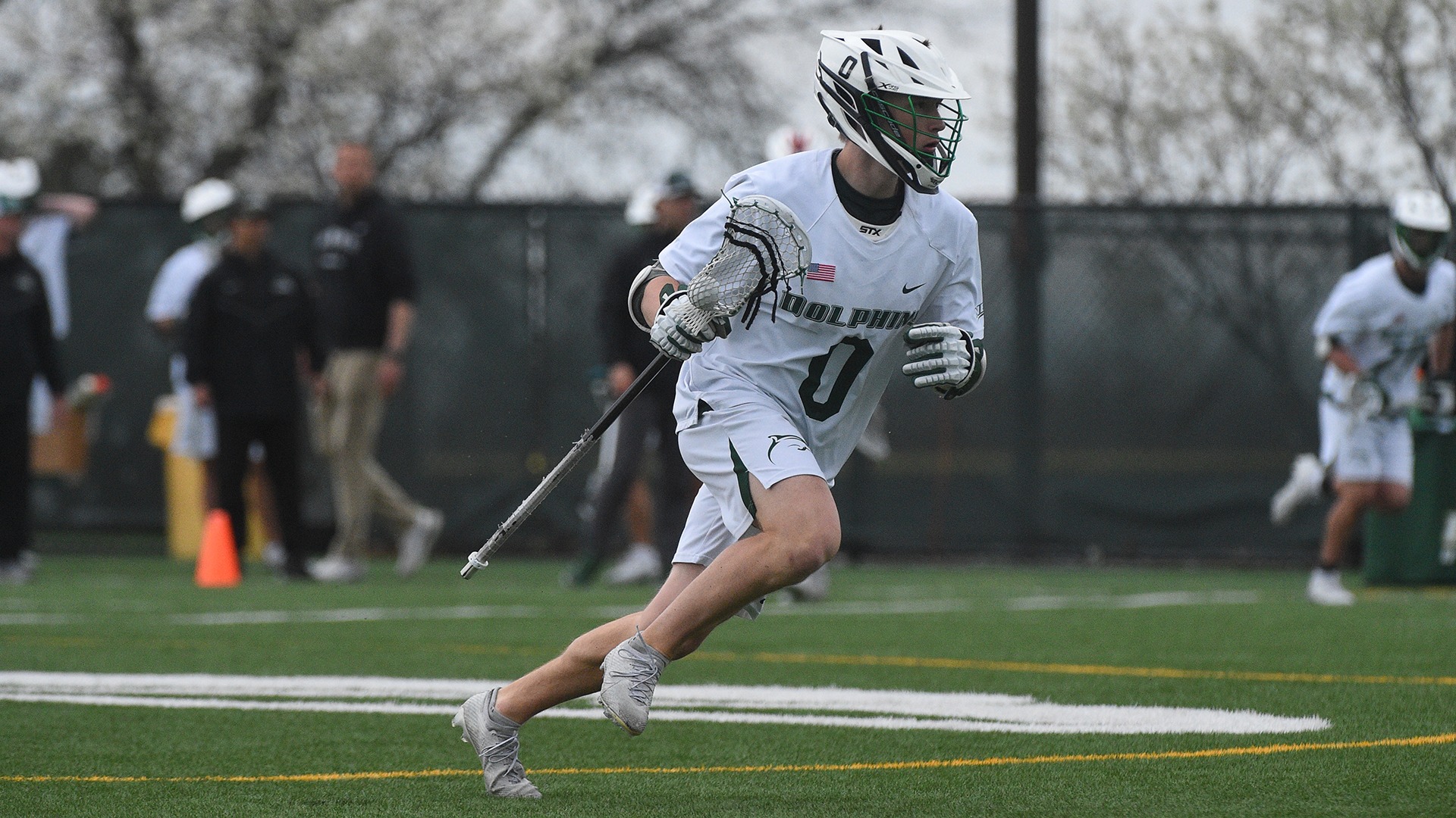 Zach Cartmill Carries the ball near midfield against Robert Morris