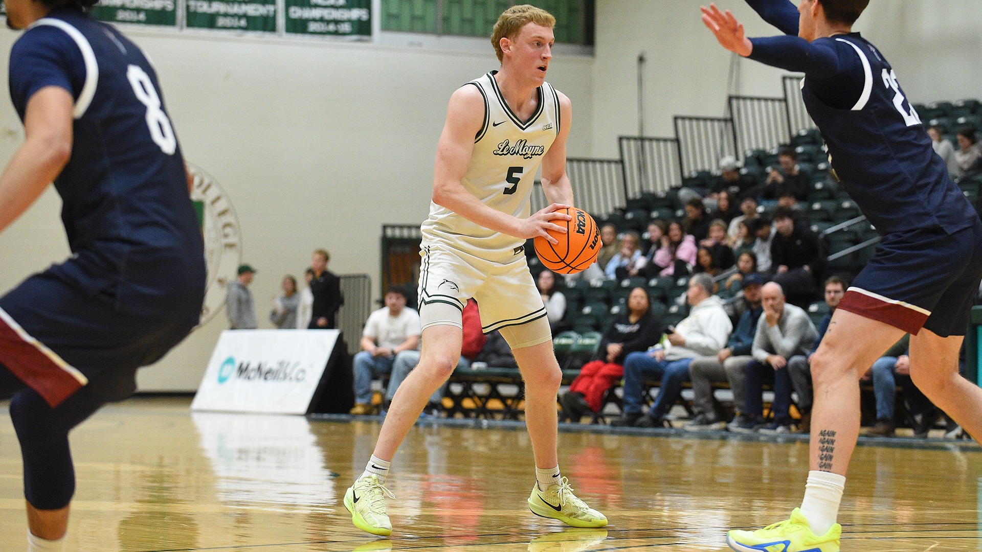 Trevor Roe holds the ball at the top of the key against FDU