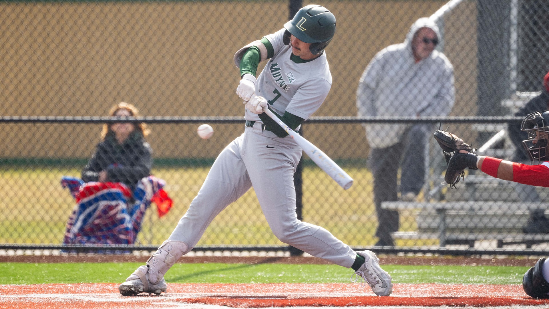 Adam Sullivan swings at the ball against Delaware State University