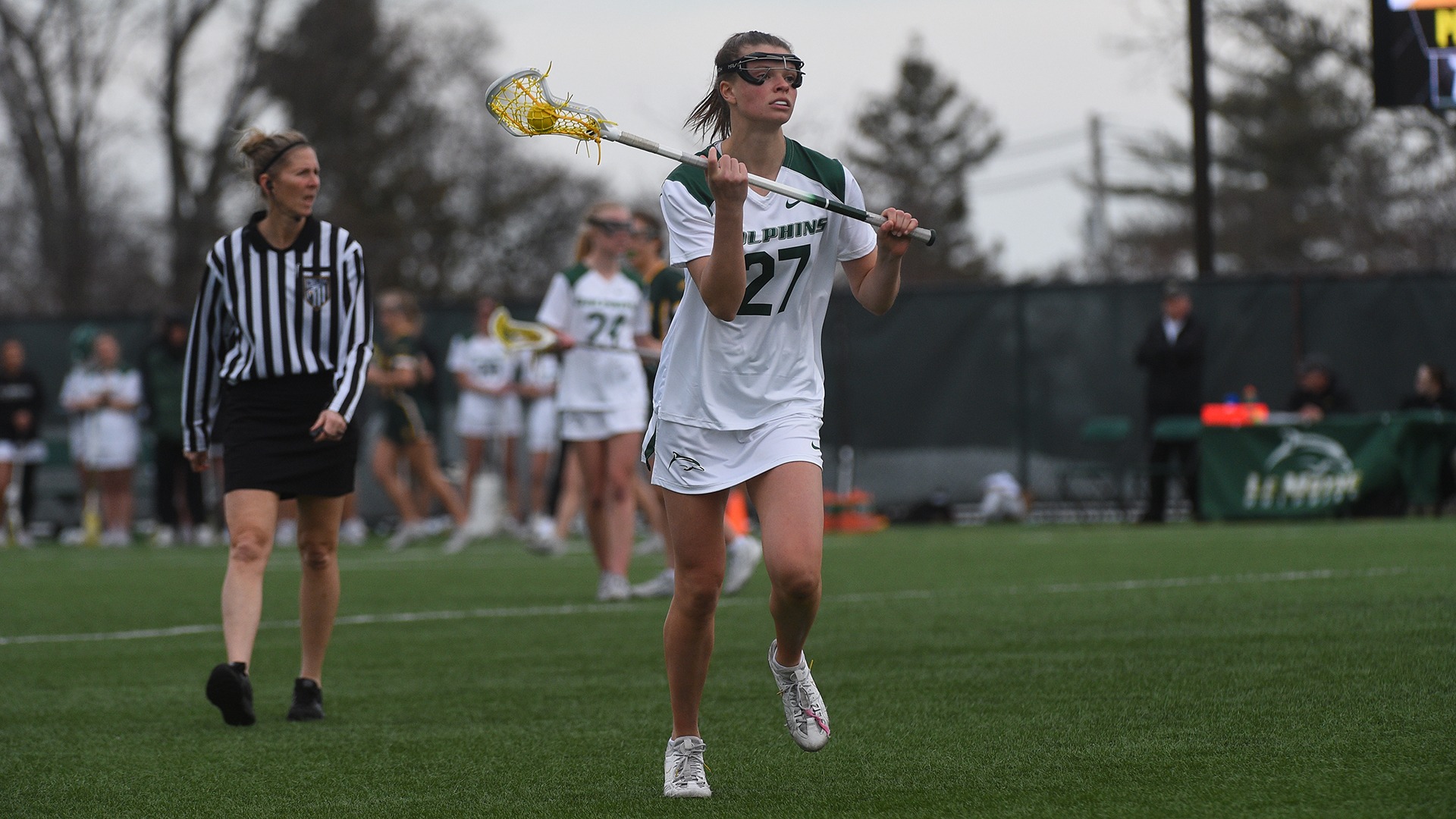 Julia Blakeslee carries the ball up field against Siena