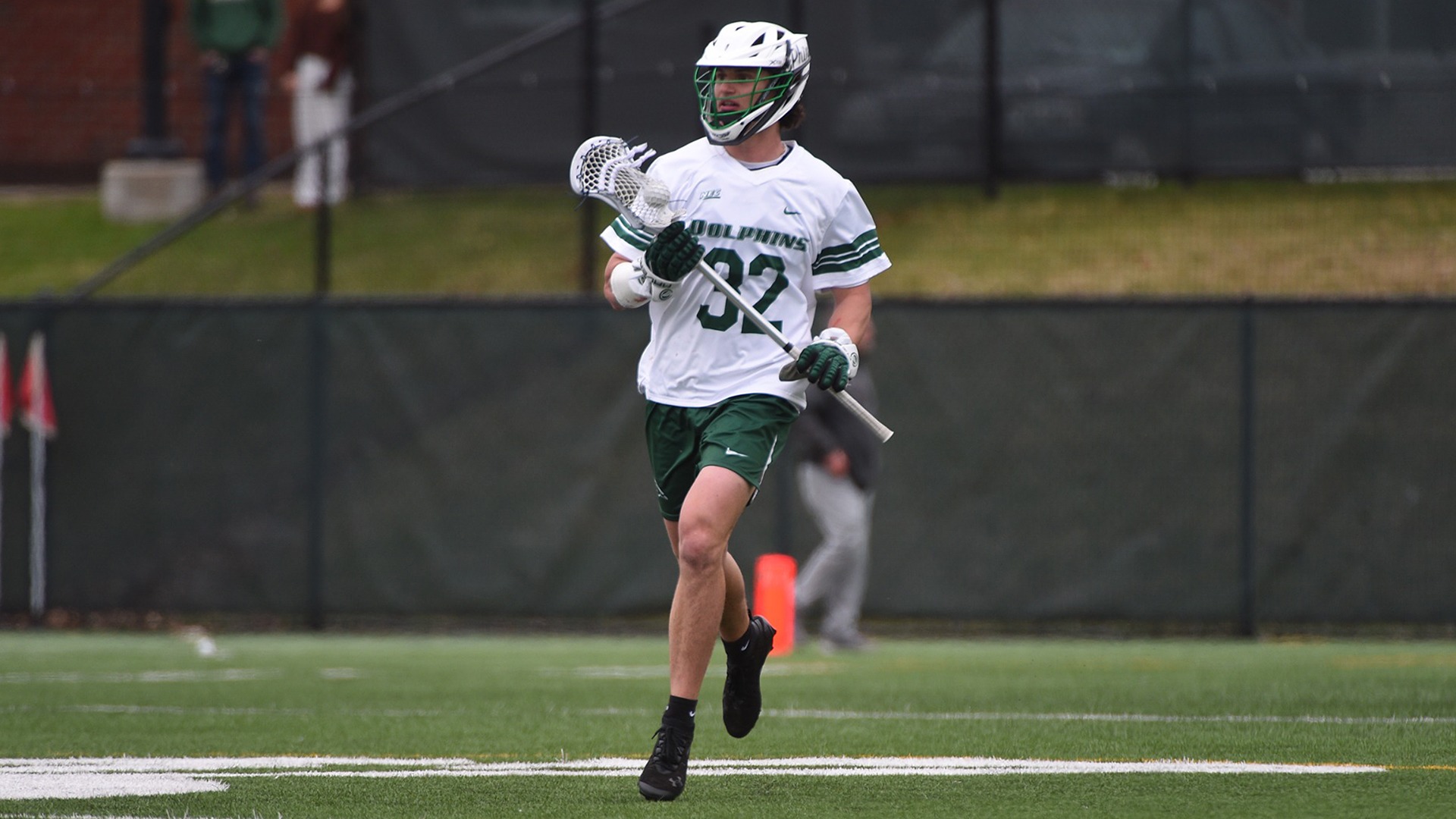 Charles Colombi Carries the ball Up Field against Detroit Mercy