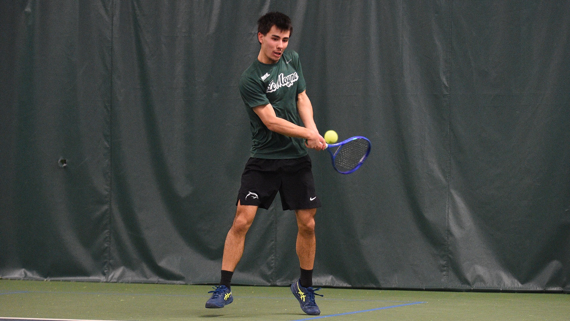 Lorenzo Bortolaso hits a backhand shot against Stonehill