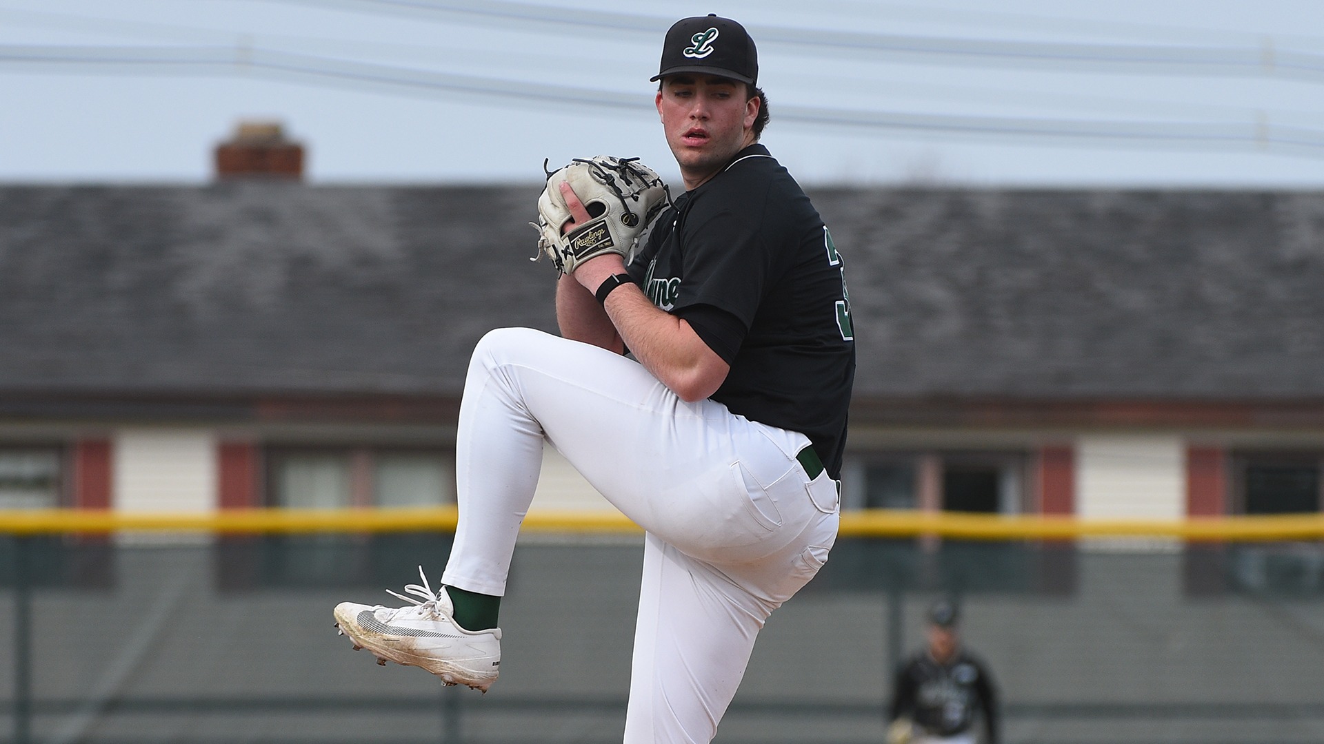 Jack Molini Winds up to deliver a pitch against Coppin State