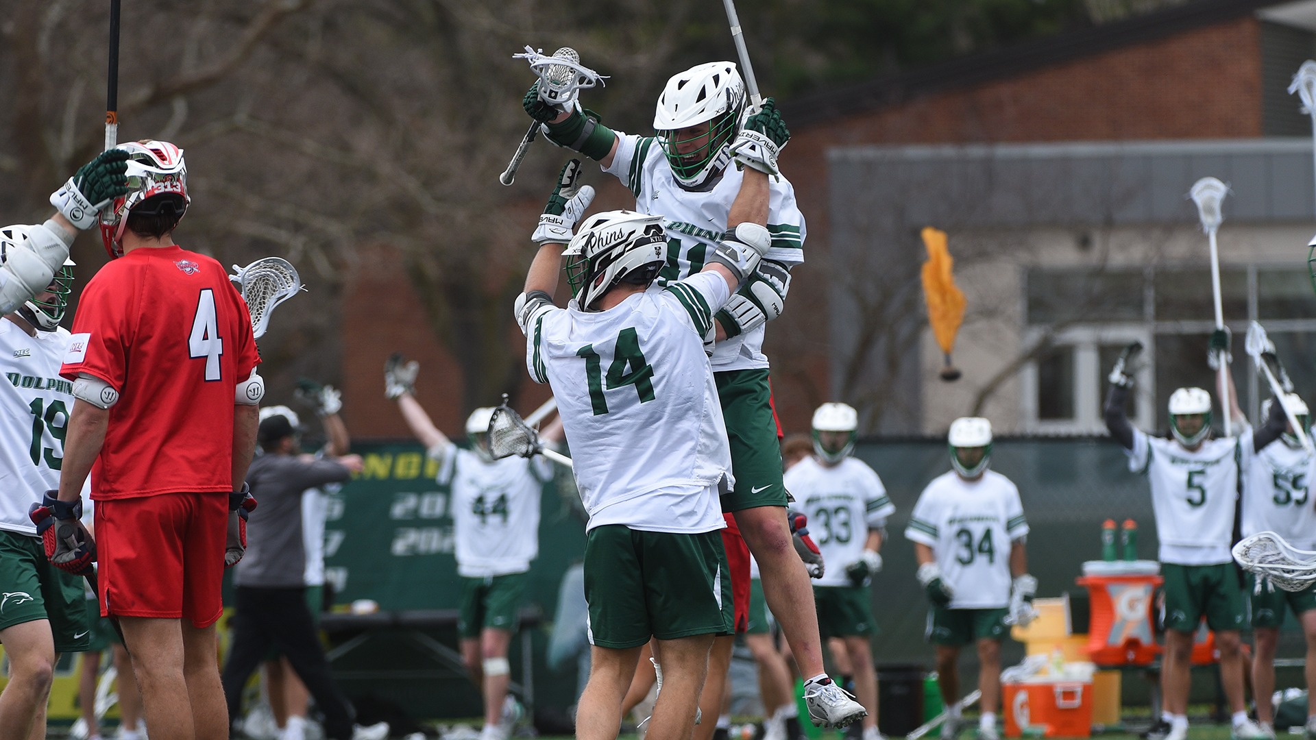 Thomas Berry and Cole Mayclim celebrate a goal against Detroit Mercy