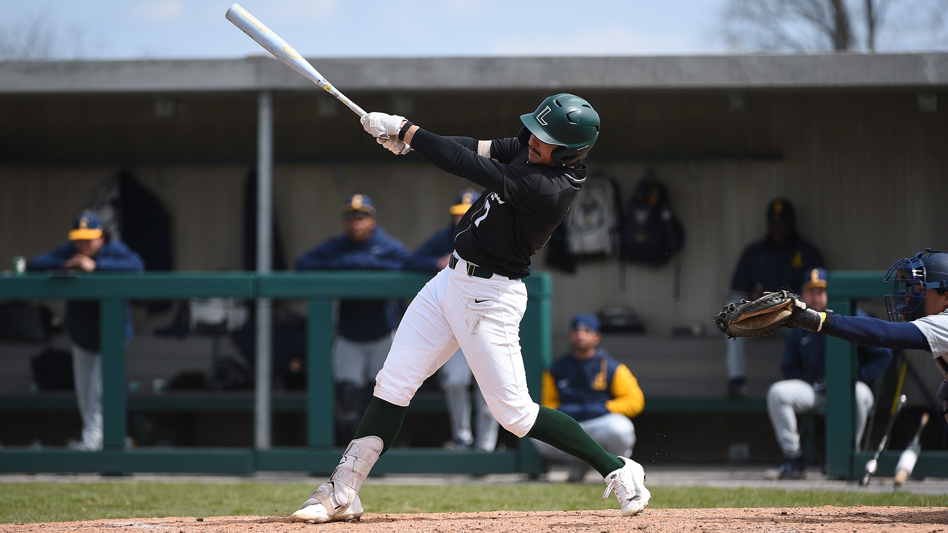Sullivan follows through on a swing against Coppin State