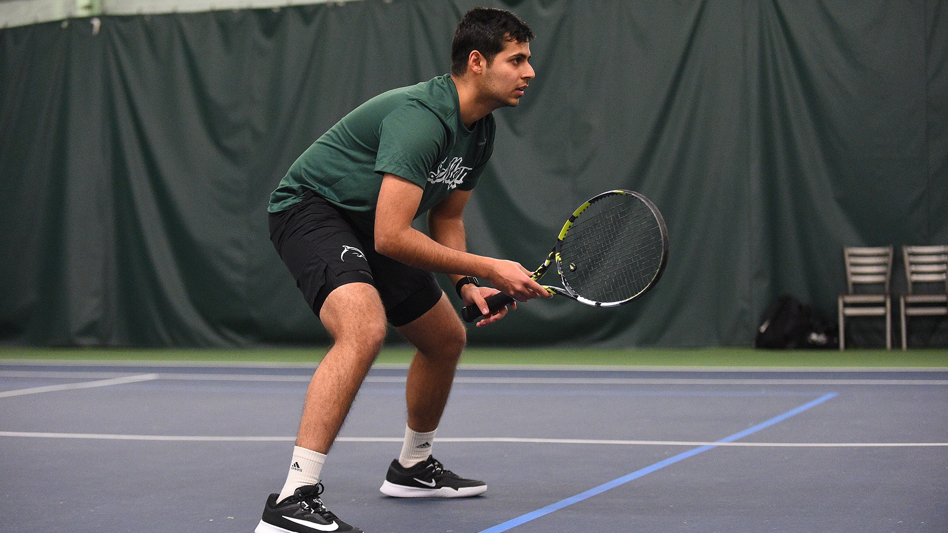 Navya Verma awaits a serve against Stonehill