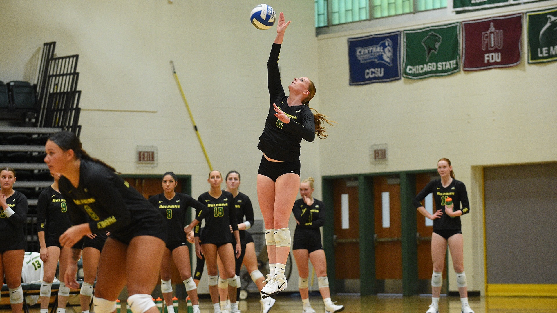 Branwyn Lupton serves the ball against Rider University