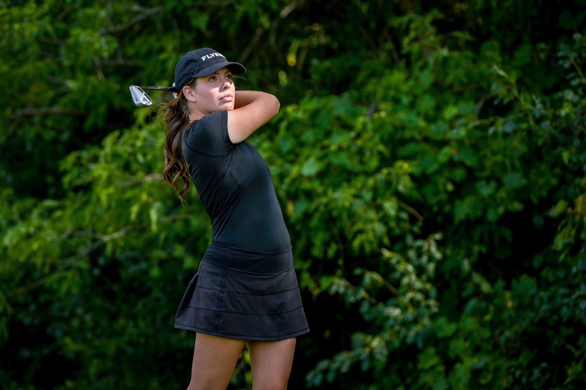 Kendall Farm hits an approach shot.