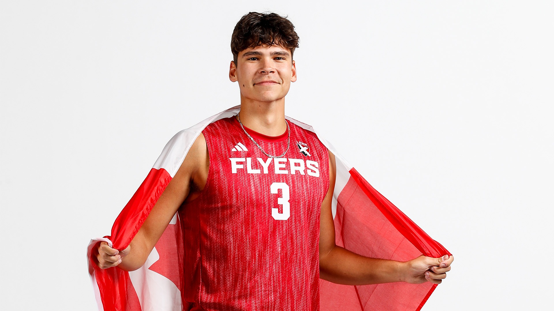 Gavin Deep poses with the Canadian Flag