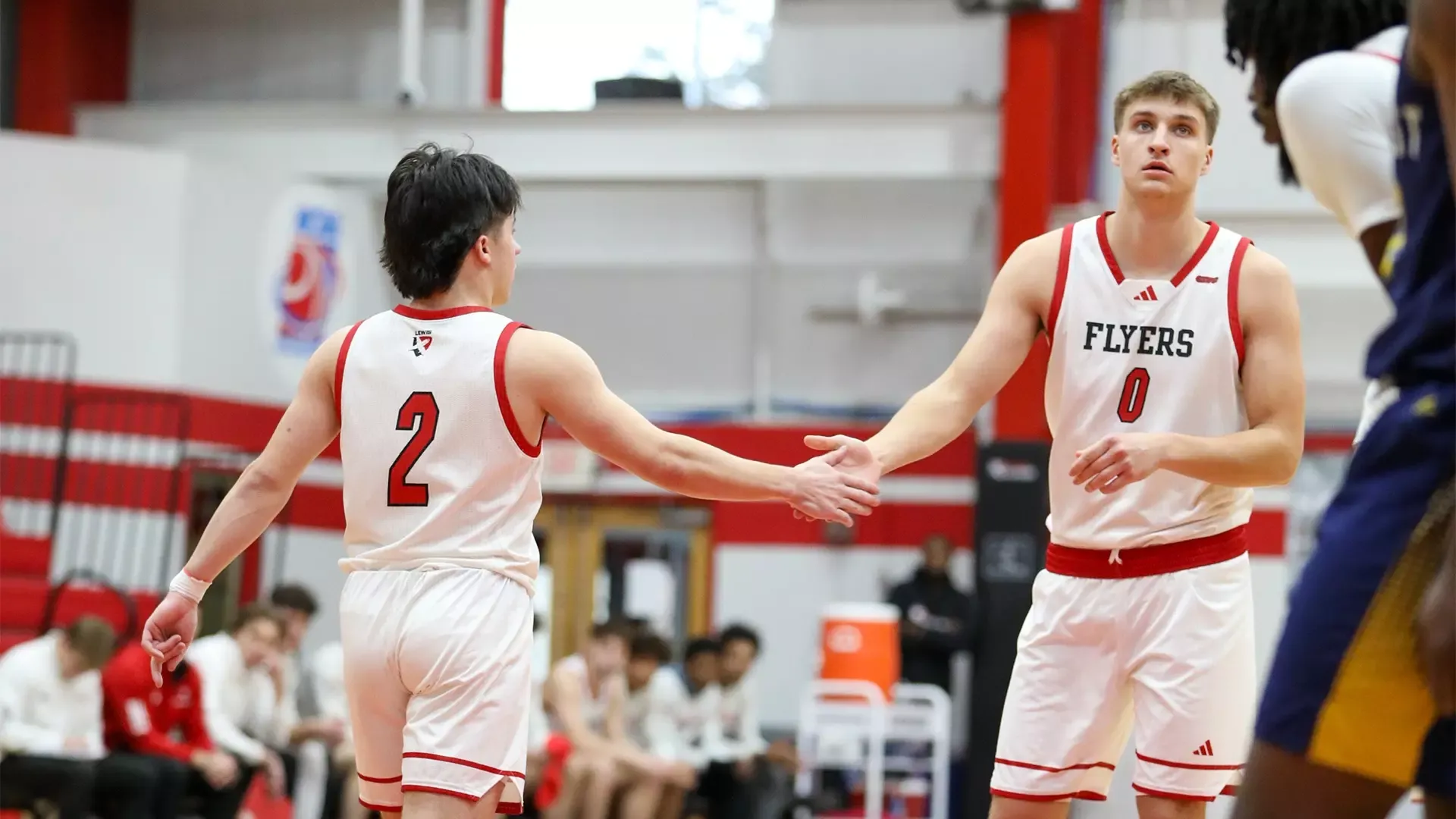 Cale Cosme and Arius Alijosius high-five