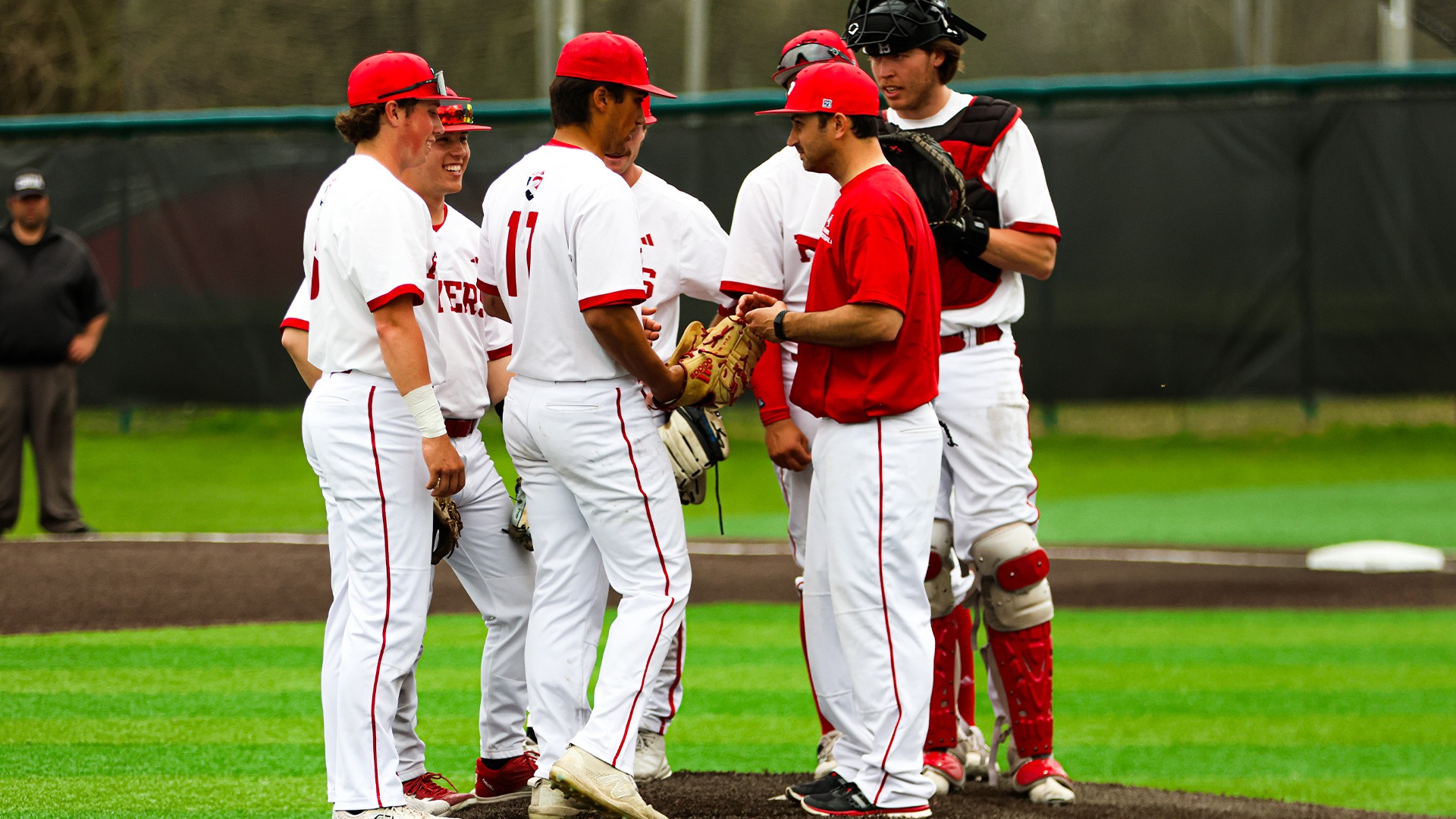 Mike Vucsko has a mound visit with his team