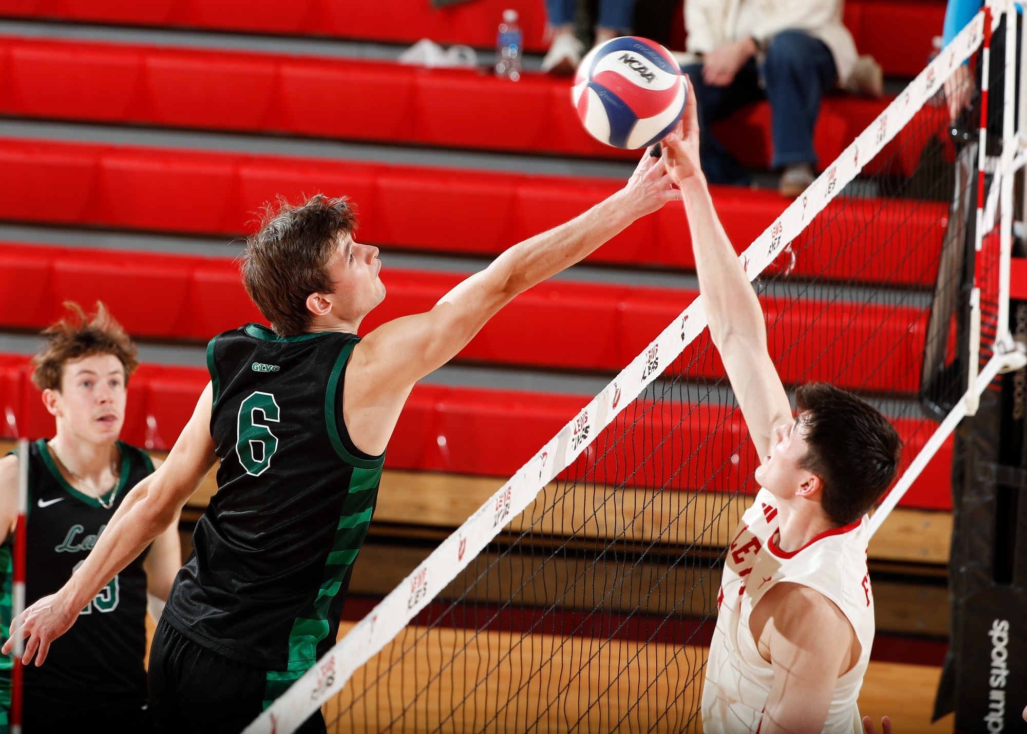 Cole Sweitzer kills a ball against Roosevelt