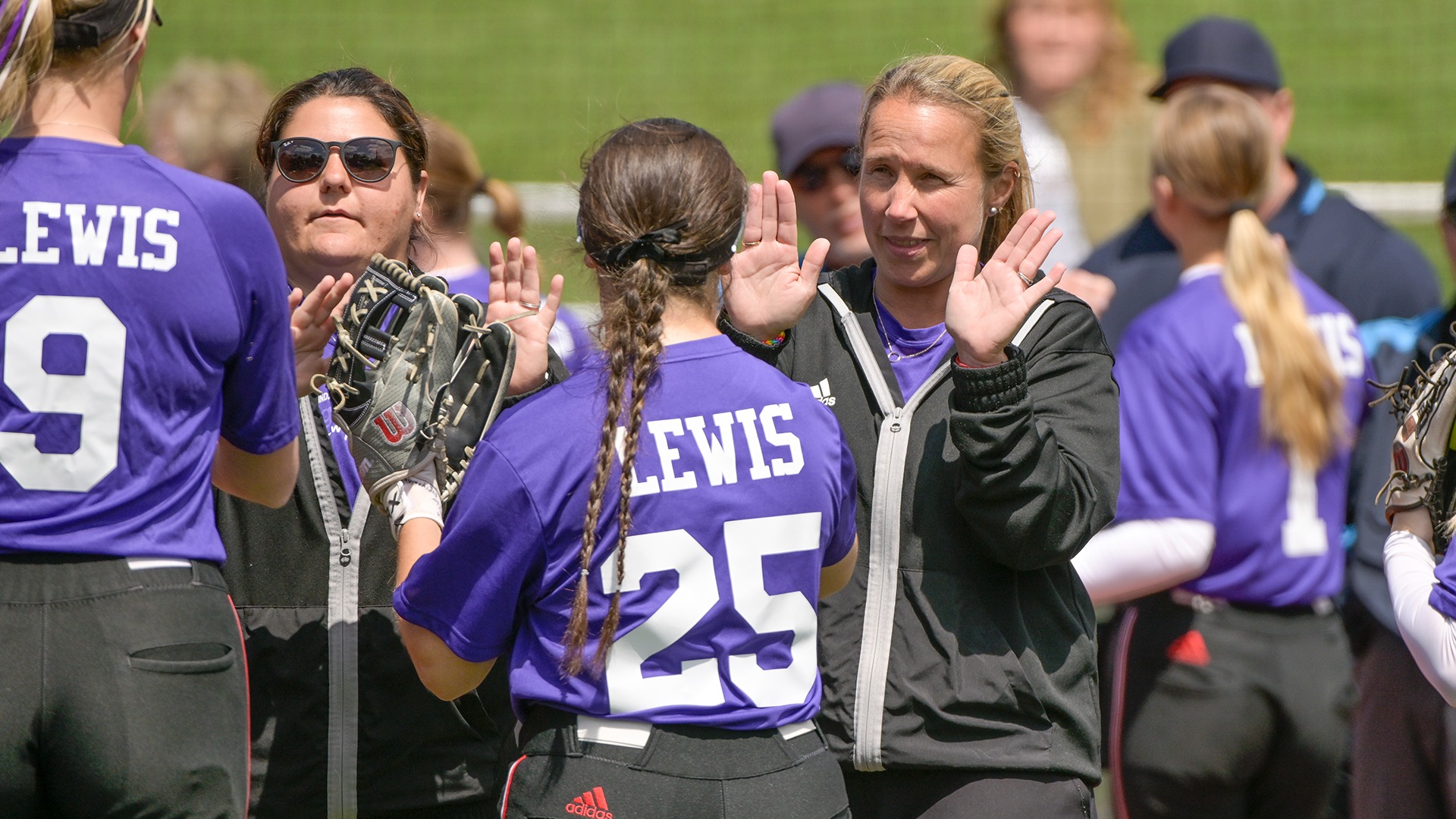 Becky Pearl hi-fives her players