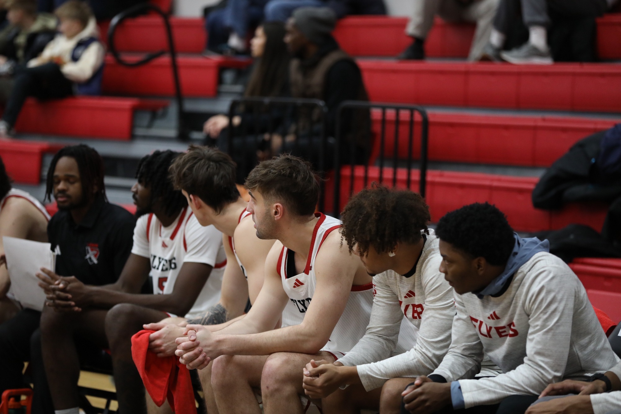 Men's basketball bench vs East West