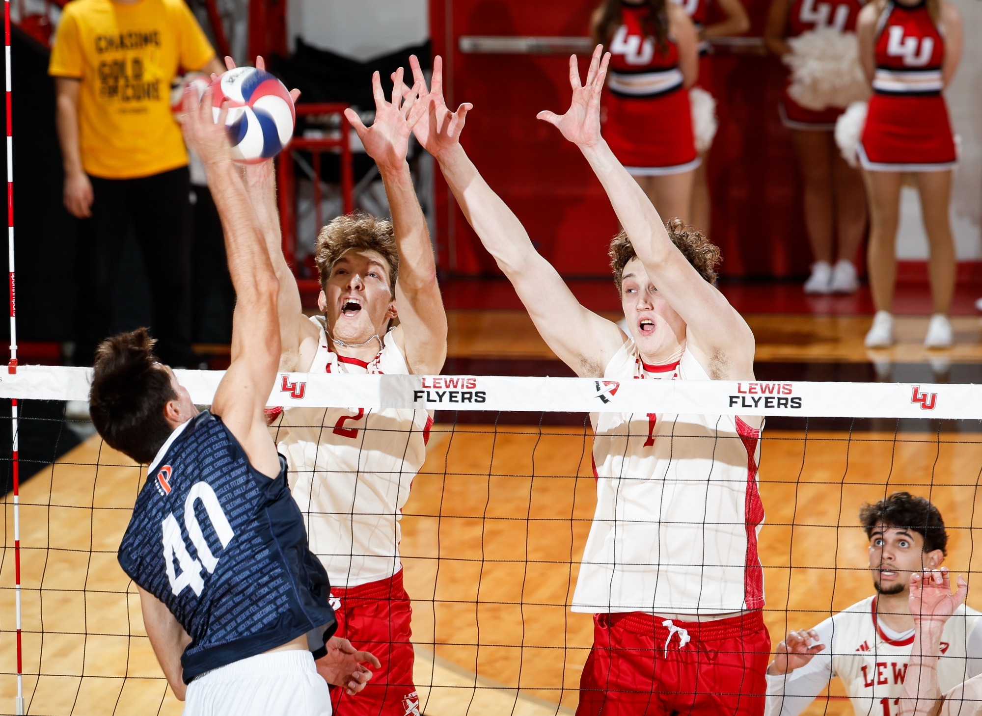 Cameron Hoying and Frederick Kreuger-Beer block a ball