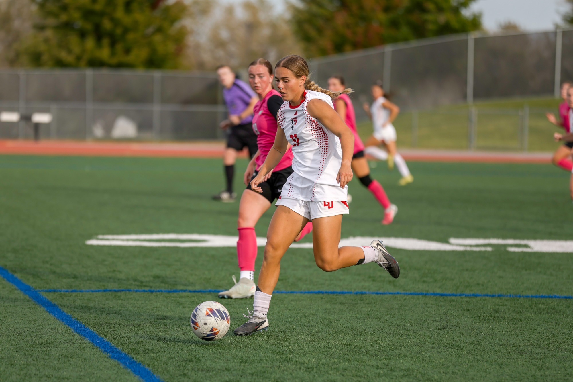 Reese Capion runs up the field