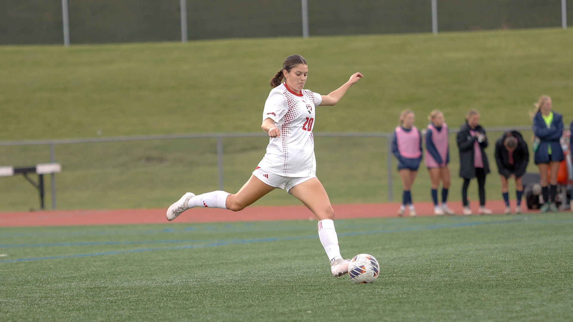 Anna Sainato kicks a ball