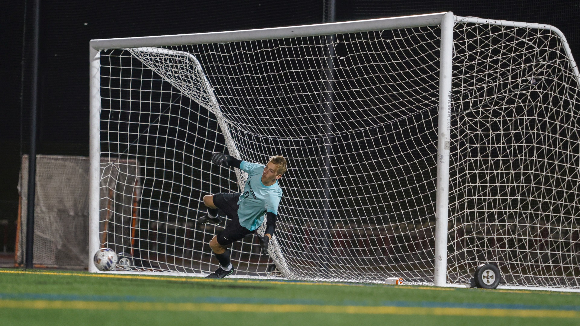 Jan Foret dives to save a ball