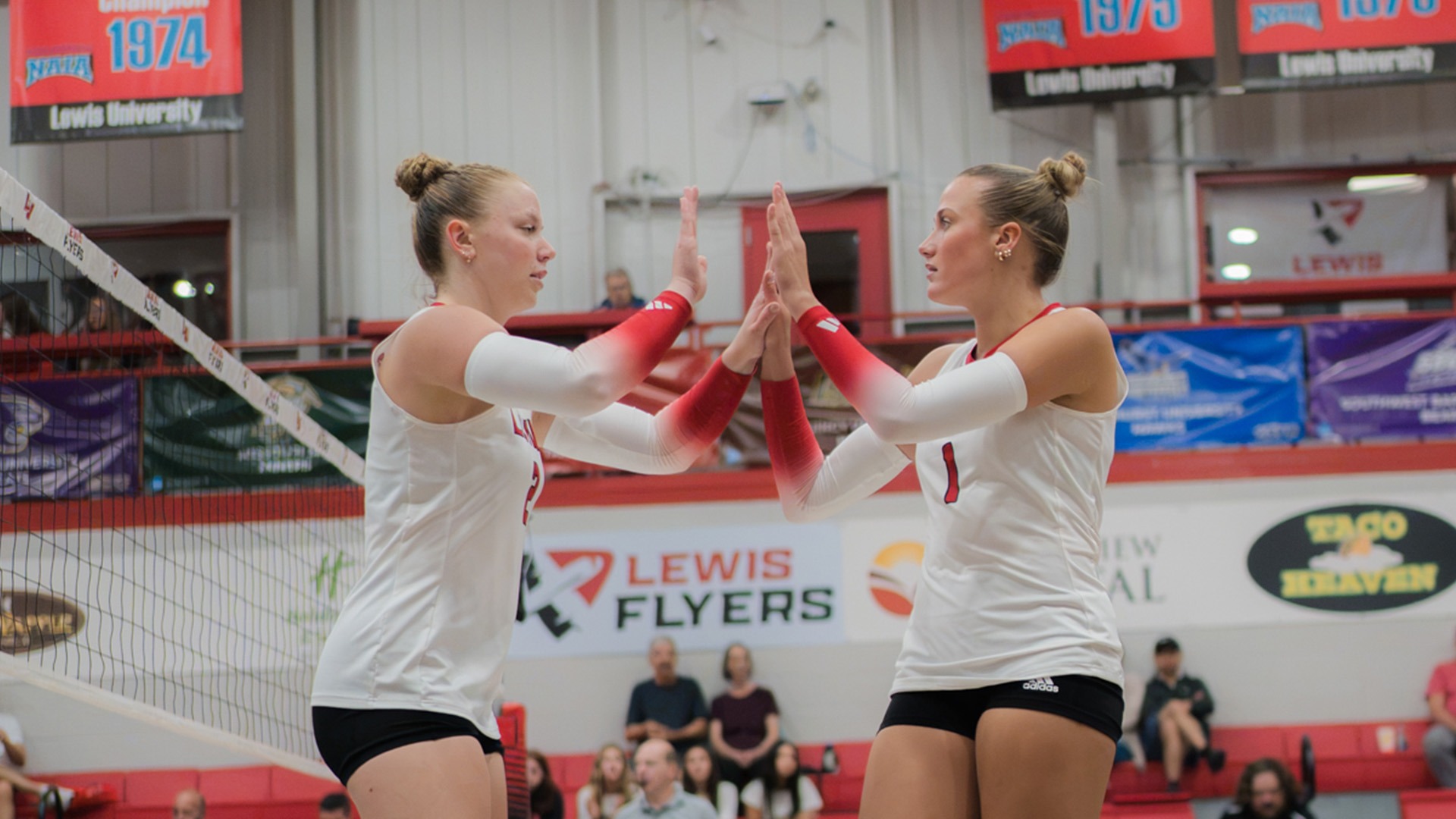 Marin Grossman and Hannah Dietzenbach high five