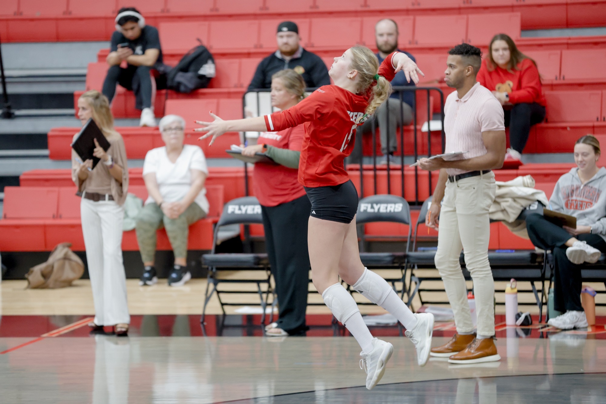 Grace Malek serves the ball