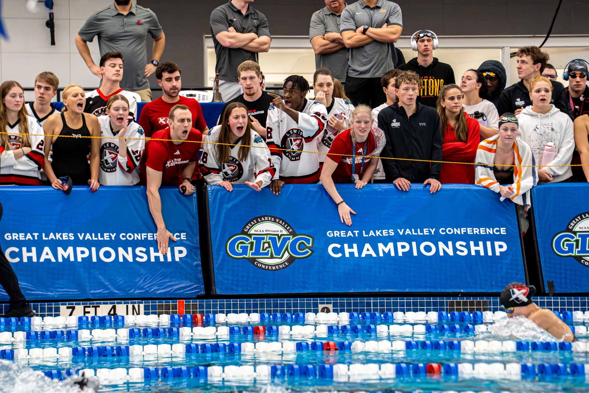 The Lewis team cheers on their teammates
