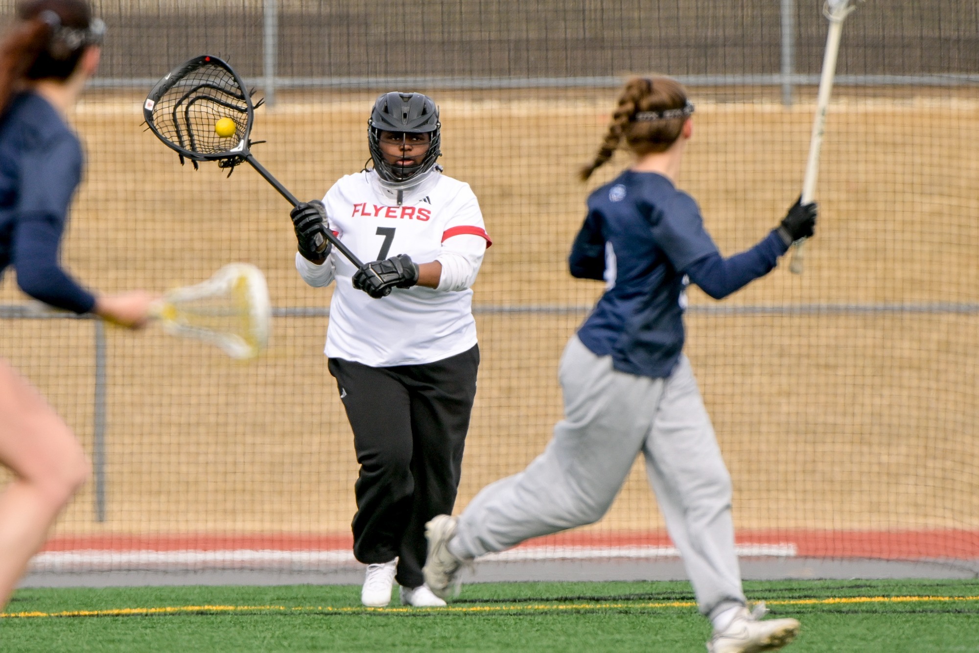 Sophia Fountain looks to pass a ball