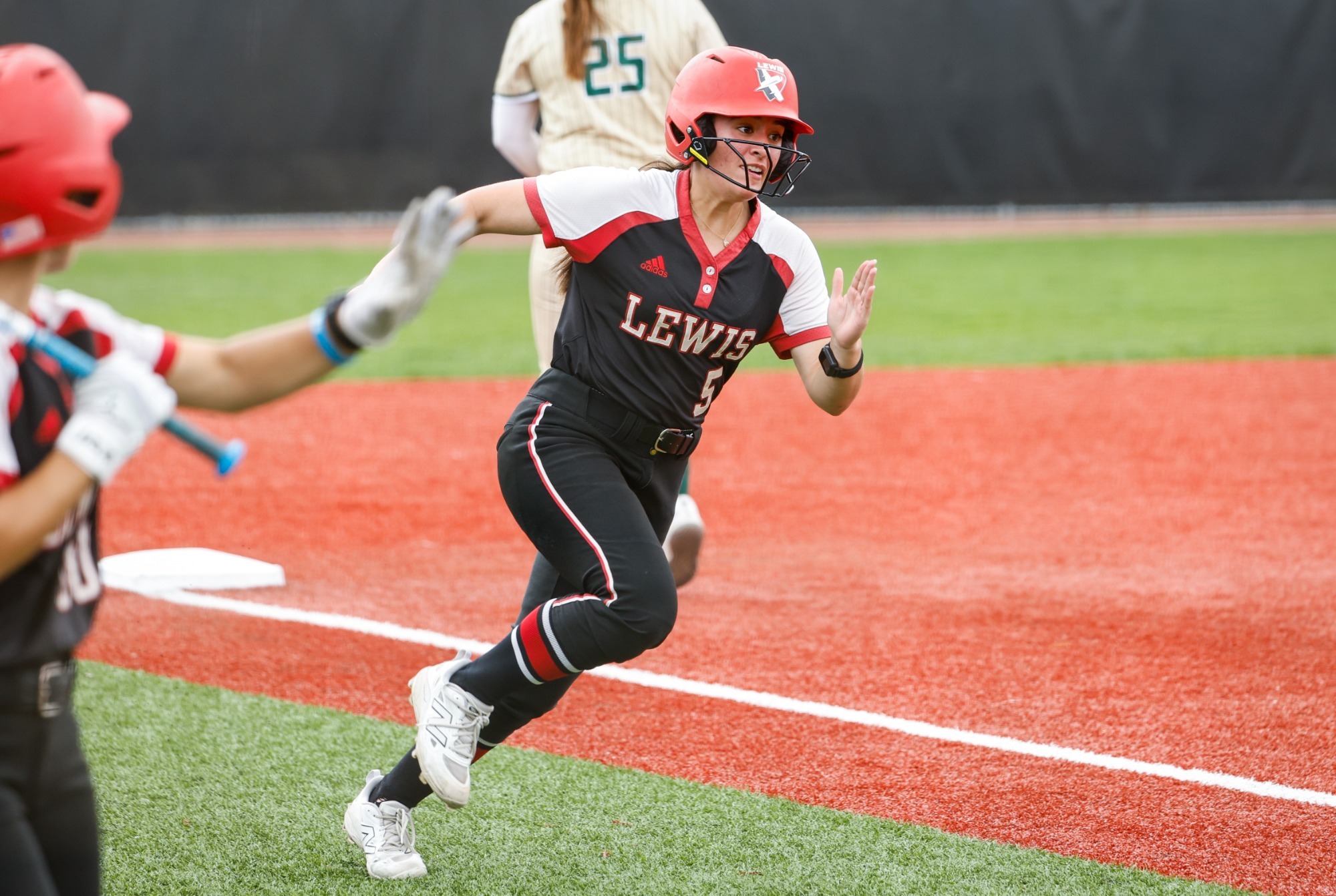 Jozlynn Pacheco rounds third base
