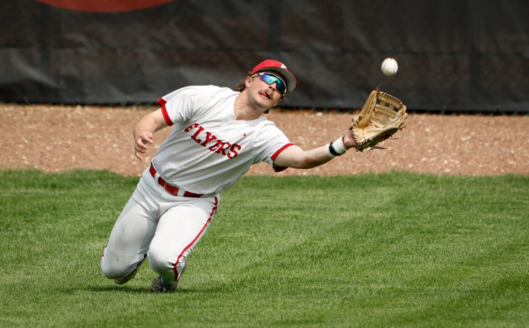 Chris Daugherty dives for a ball