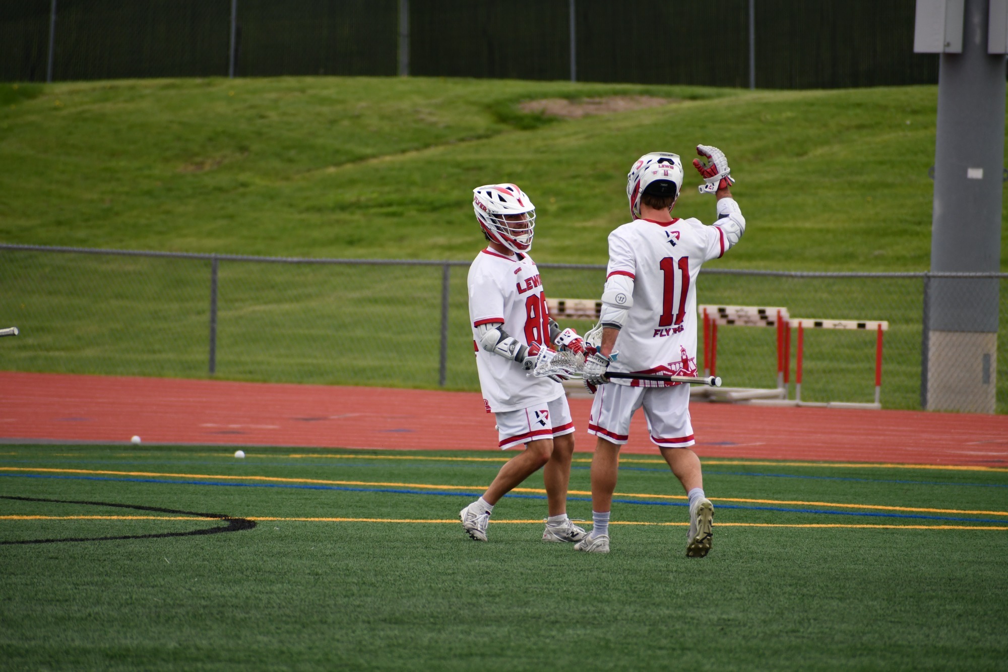 Malikye Good and Kohl Wesner high five