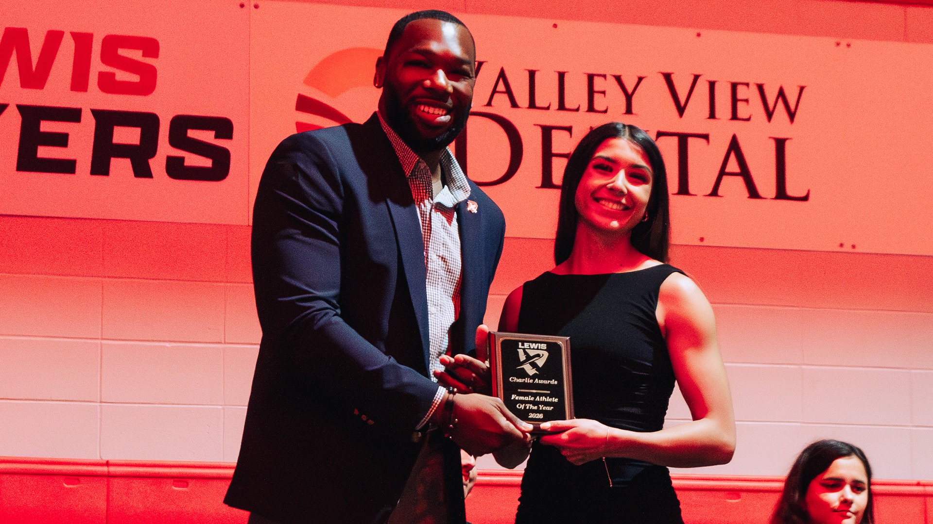 Denise Hernandez poses with her award