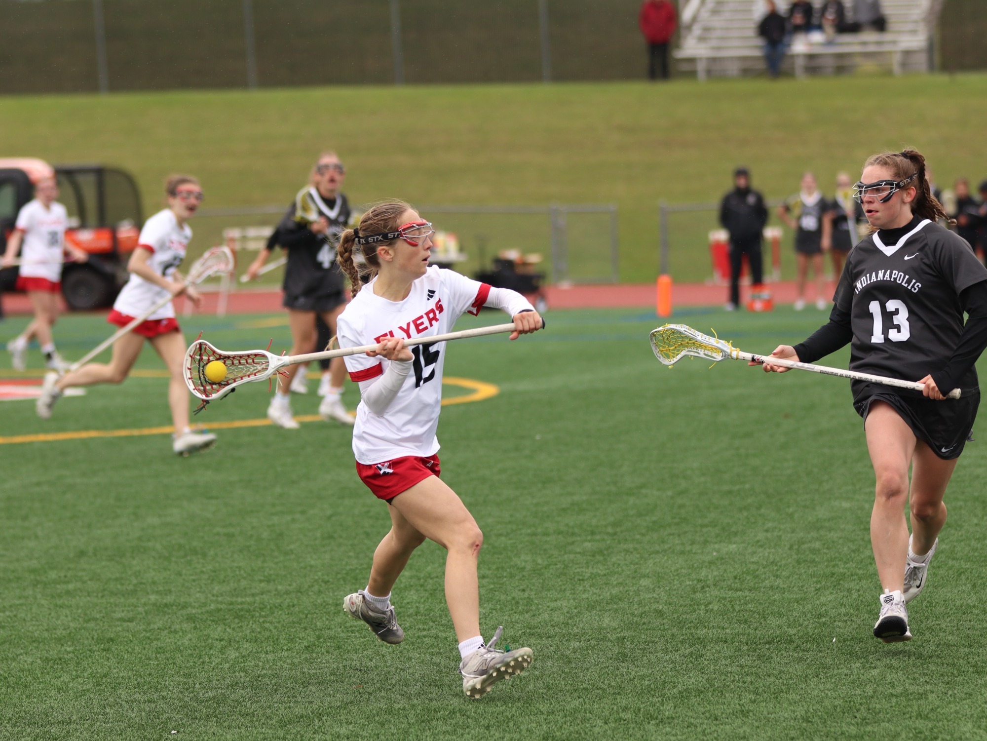 Devyn Hartley tries to pass by a UIndy defender