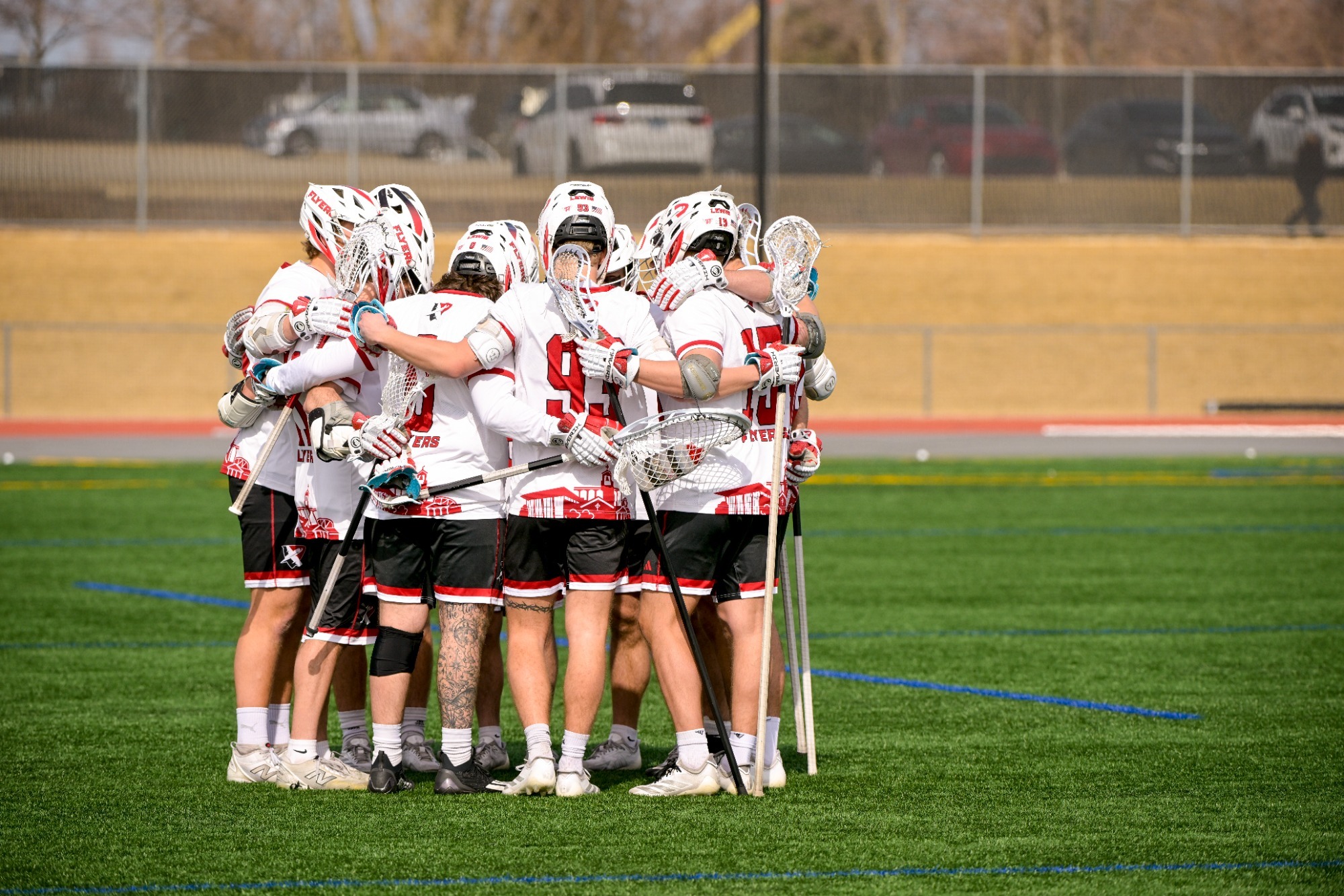 Lewis men's lacrosse huddle