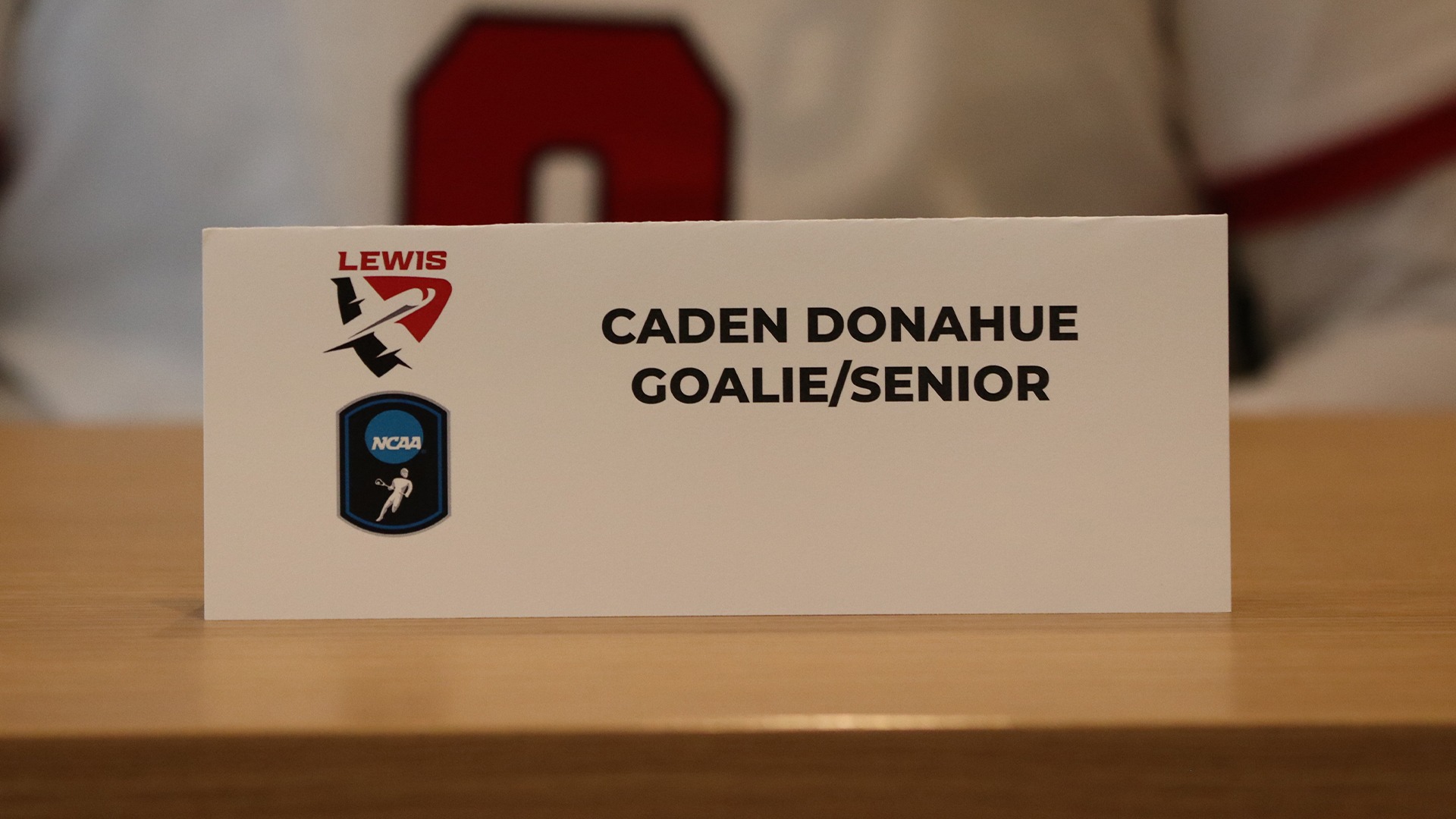 Caden Donahue postgame press conference card