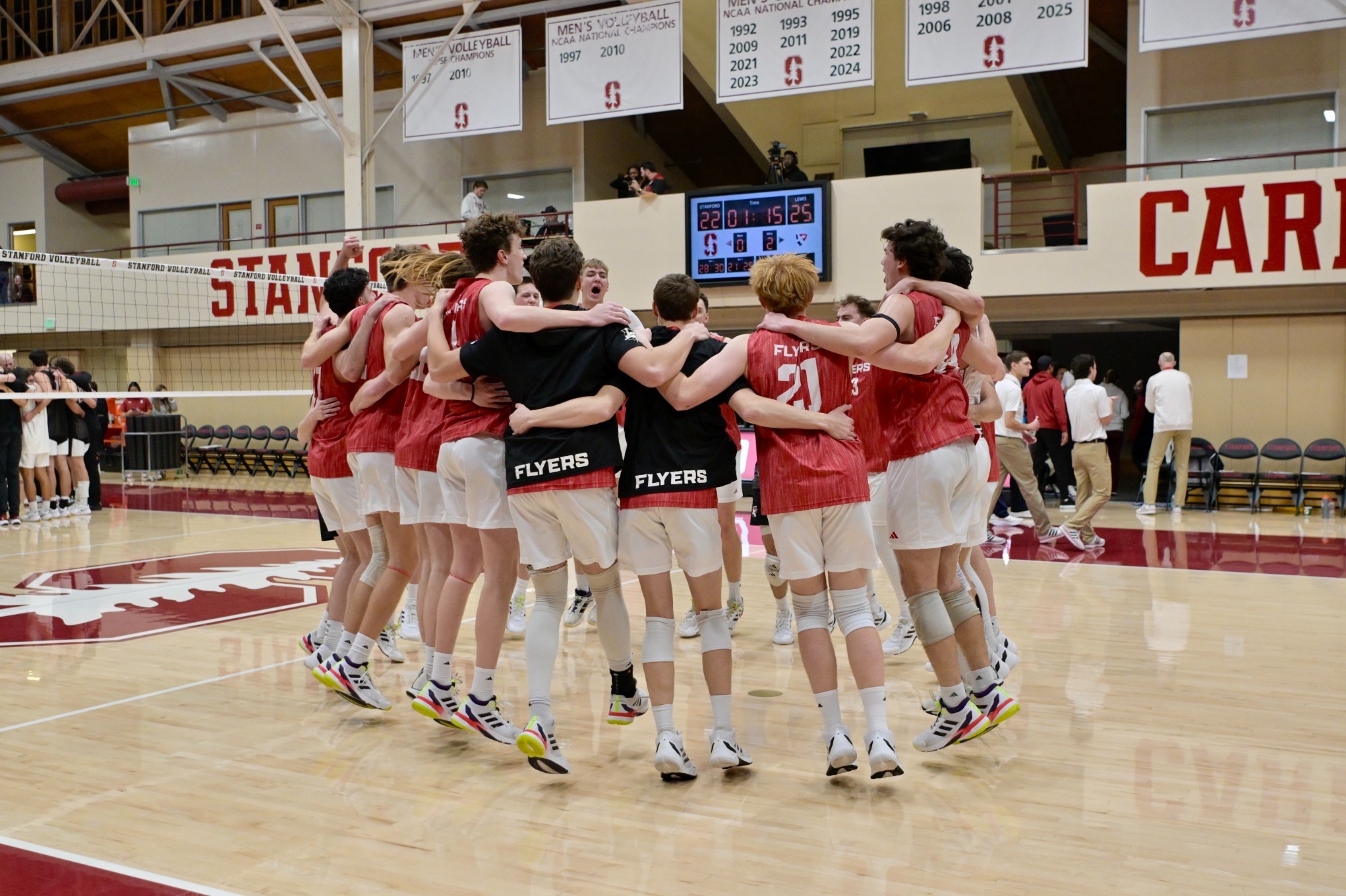 Lewis men's volleyball celebrates a win at Stanford