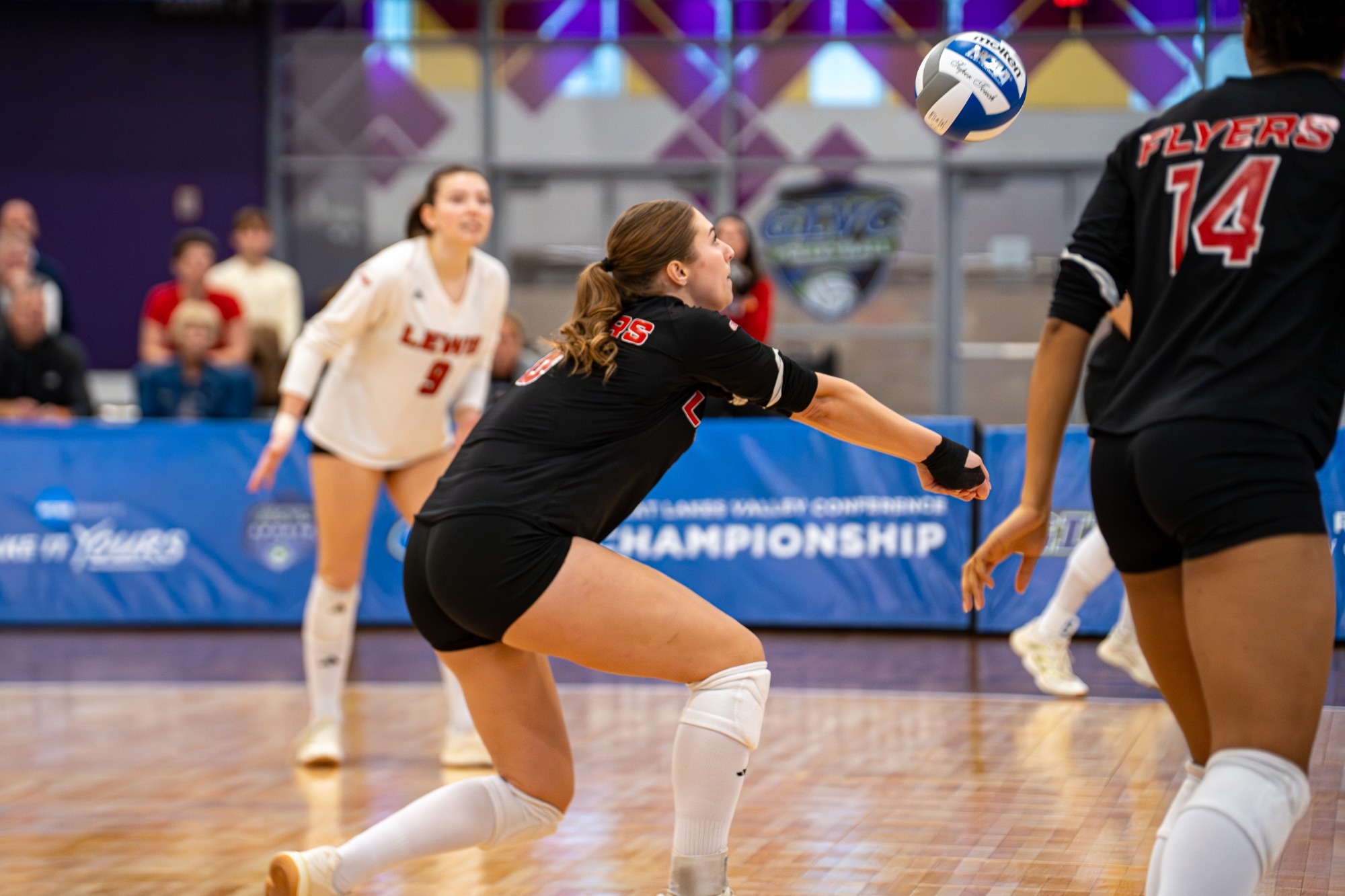 Lauren Buxton digs a ball