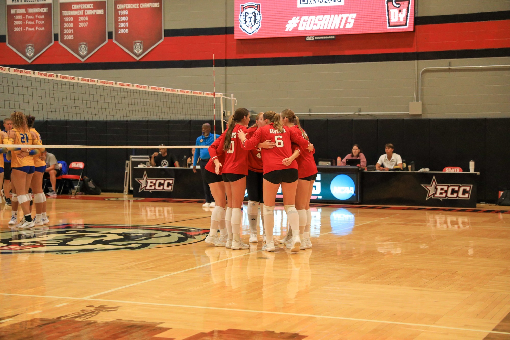 Women's Volleyball huddle at D'Youville