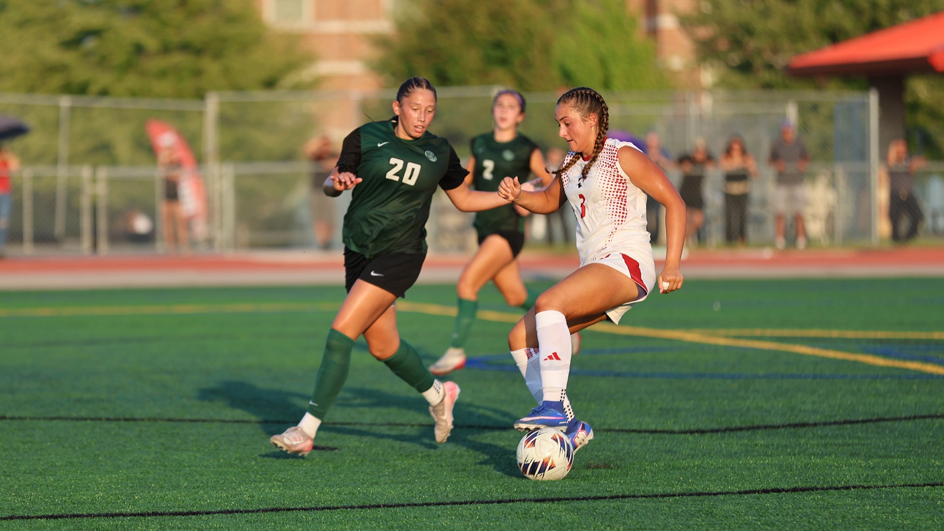 Talia Kaempf dribbles the ball