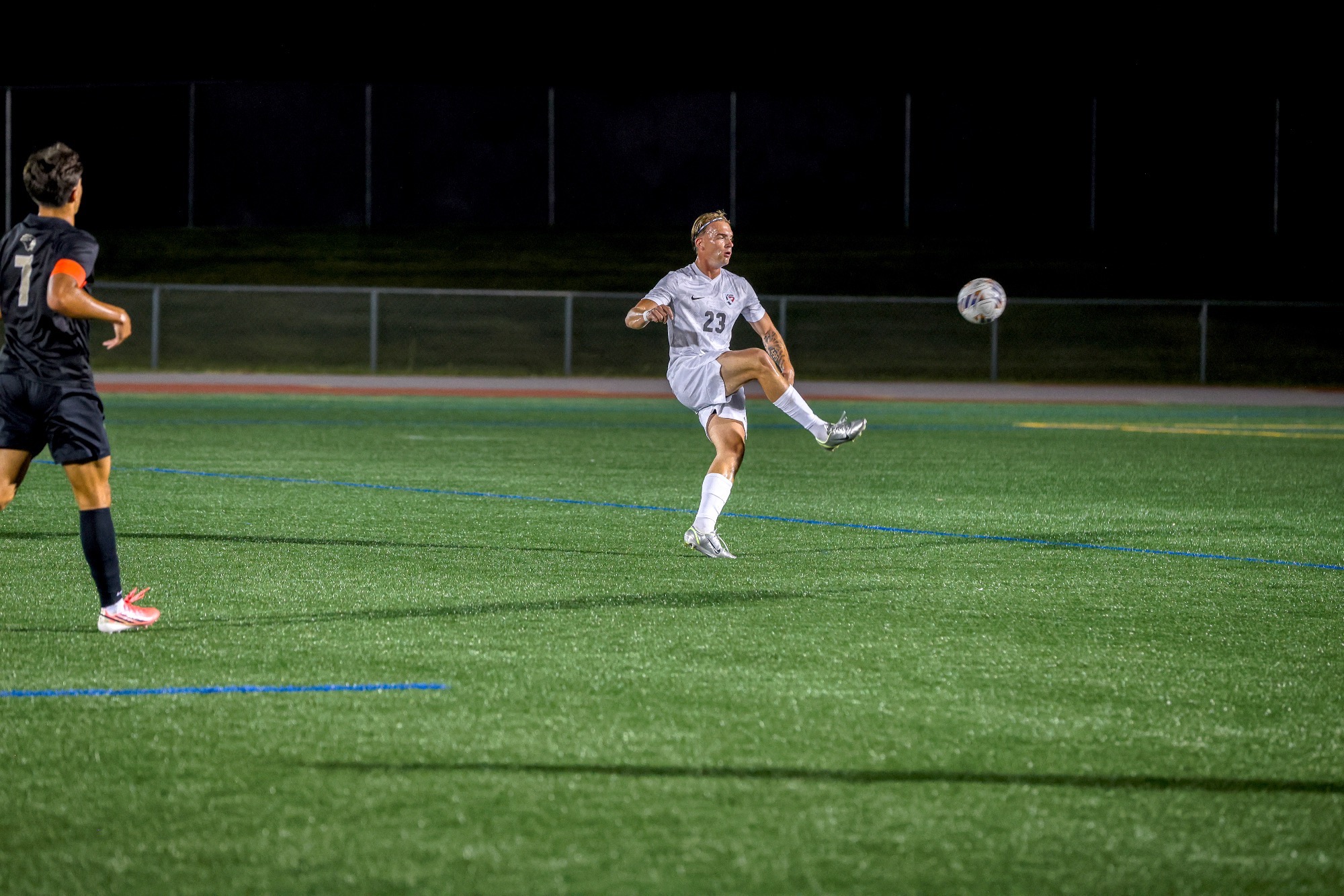 Player kicks ball